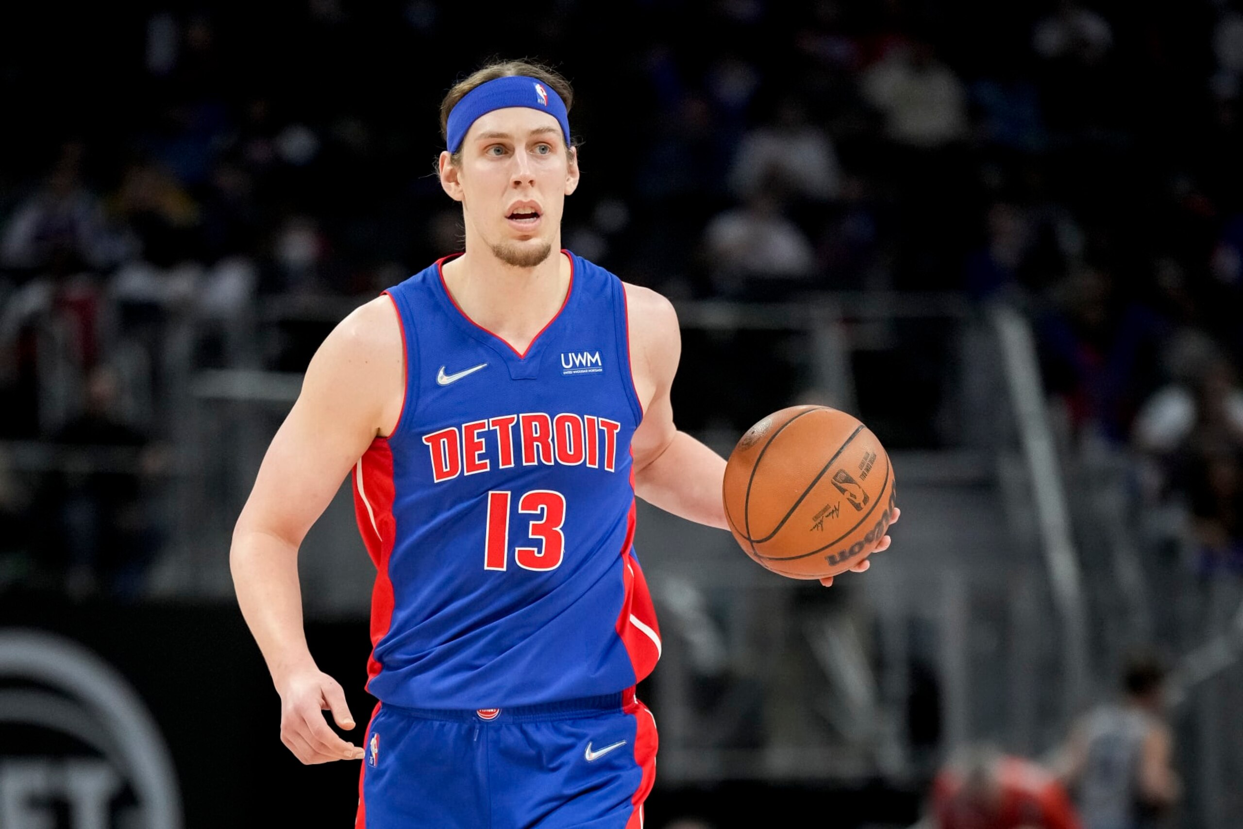 DETROIT, MICHIGAN - APRIL 08: Kelly Olynyk #13 of the Detroit Pistons handles the ball against the Milwaukee Bucks during the second quarter at Little Caesars Arena on April 08, 2022 in Detroit, Michigan. NOTE TO USER: User expressly acknowledges and agrees that, by downloading and or using this photograph, User is consenting to the terms and conditions of the Getty Images License Agreement. (Photo by Nic Antaya/Getty Images)