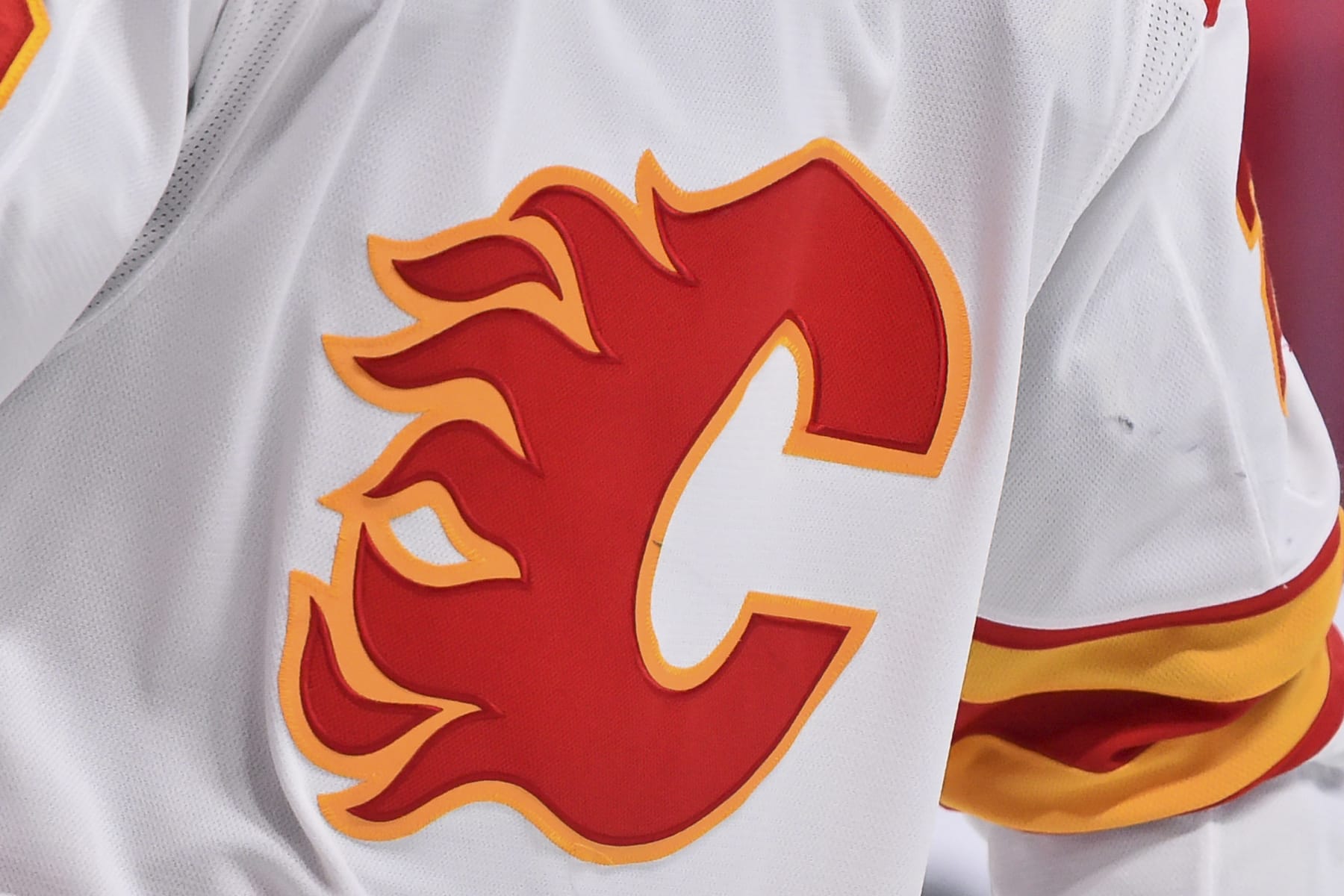MONTREAL, QC - JANUARY 30:  A detail of the Calgary Flames logo is seen during the second period against the Montreal Canadiens at the Bell Centre on January 30, 2021 in Montreal, Canada.  The Calgary Flames defeated the Montreal Canadiens 2-0.  (Photo by Minas Panagiotakis/Getty Images)