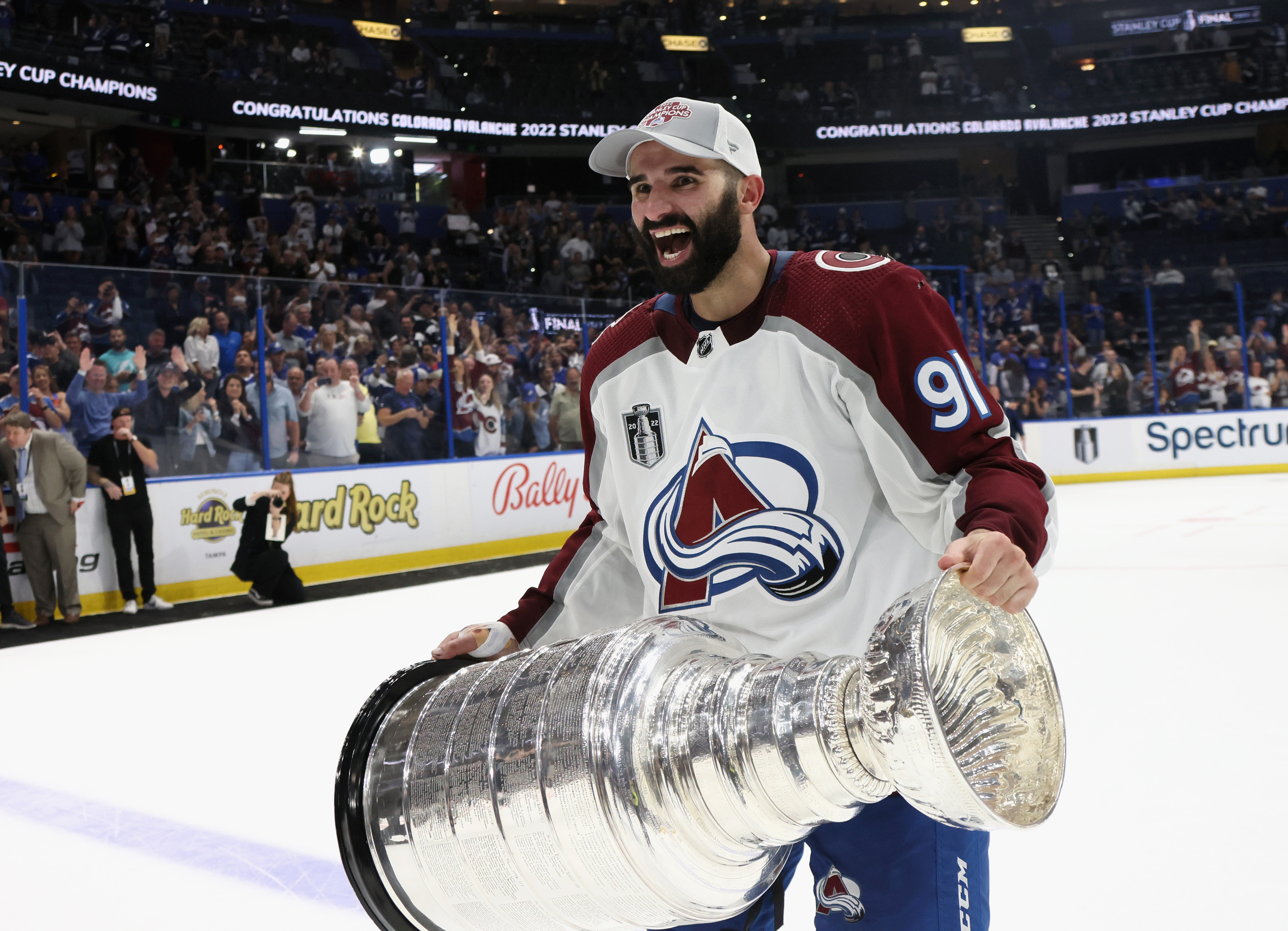 TAMPA, FLORIDA - JUNE 26: Nazem Kadri #91 of the Colorado Avalanche carries the Stanley Cup following the series winning victory over the Tampa Bay Lightning in Game Six of the 2022 NHL Stanley Cup Final at Amalie Arena on June 26, 2022 in Tampa, Florida. (Photo by Bruce Bennett/Getty Images)