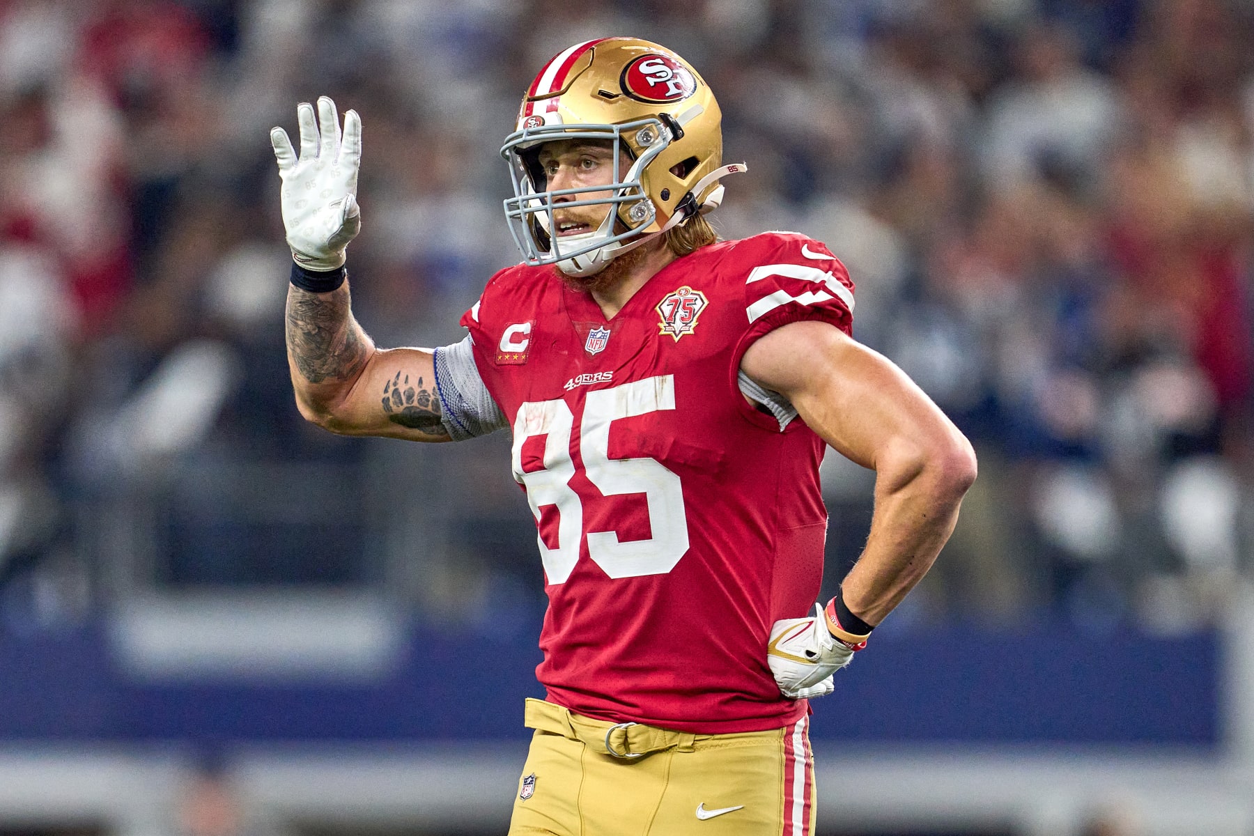 ARLINGTON, TX - JANUARY 16: San Francisco 49ers tight end George Kittle (85) waves for a water bottle from the sidelines during the NFC Wild Card game between the San Francisco 49ers and the Dallas Cowboys on January 16, 2022 at AT&T Stadium in Arlington, TX. (Photo by Robin Alam/Icon Sportswire via Getty Images)