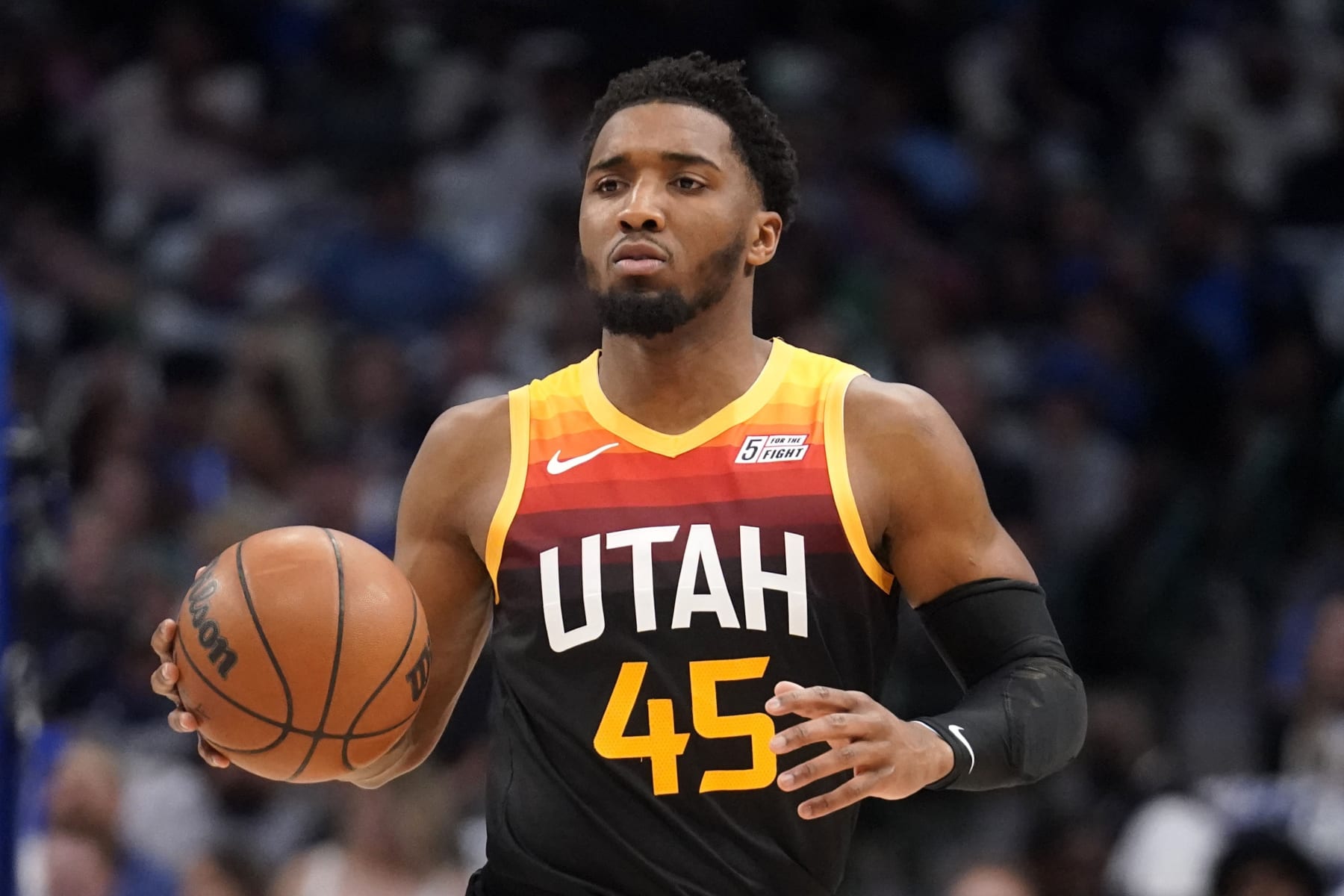 Utah Jazz guard Donovan Mitchell works up court during Game 2 of an NBA basketball first-round playoff series against the Dallas Mavericks, Monday, April 18, 2022, in Dallas. (AP Photo/Tony Gutierrez)