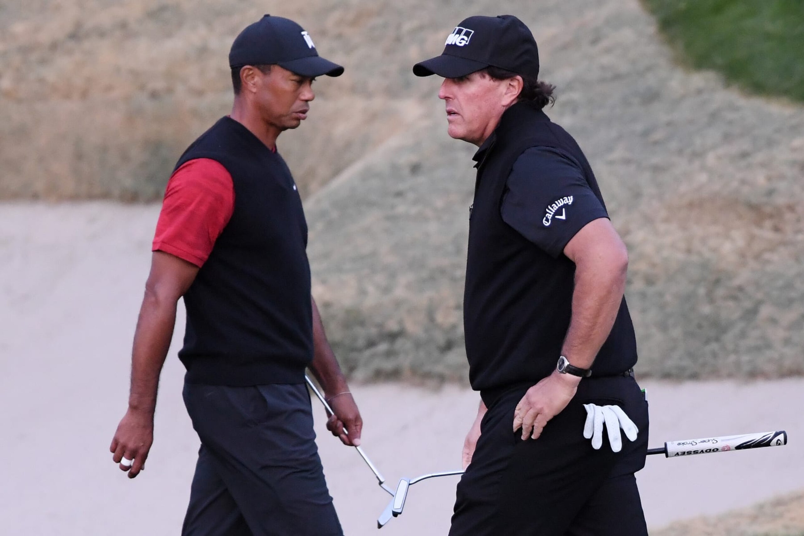 LAS VEGAS, NV - NOVEMBER 23:  Tiger Woods and Phil Mickelson walk on the 18th hole during The Match: Tiger vs Phil at Shadow Creek Golf Course on November 23, 2018 in Las Vegas, Nevada.  (Photo by Harry How/Getty Images for The Match)