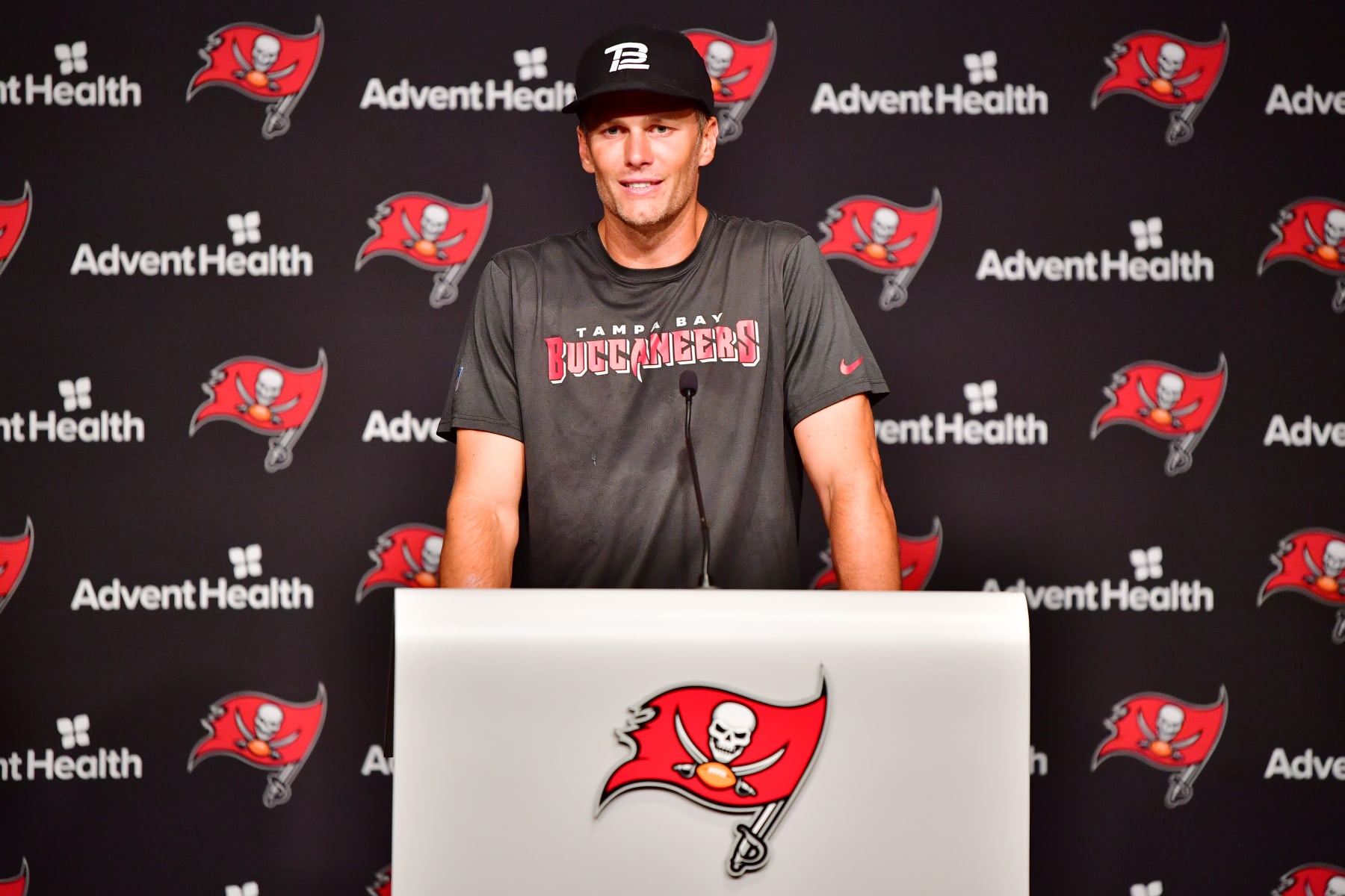 TAMPA, FLORIDA - JUNE 09: Tom Brady #12 of Tampa Bay Buccaneers answers questions at a press conference following the 2022 Buccaneers minicamp at AdventHealth Training Center on June 09, 2022 in Tampa, Florida. (Photo by Julio Aguilar/Getty Images)