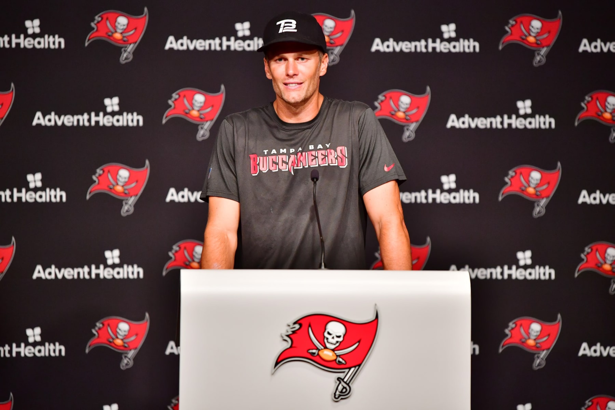 TAMPA, FLORIDA - JUNE 09: Tom Brady #12 of Tampa Bay Buccaneers answers questions at a press conference following the 2022 Buccaneers minicamp at AdventHealth Training Center on June 09, 2022 in Tampa, Florida. (Photo by Julio Aguilar/Getty Images)