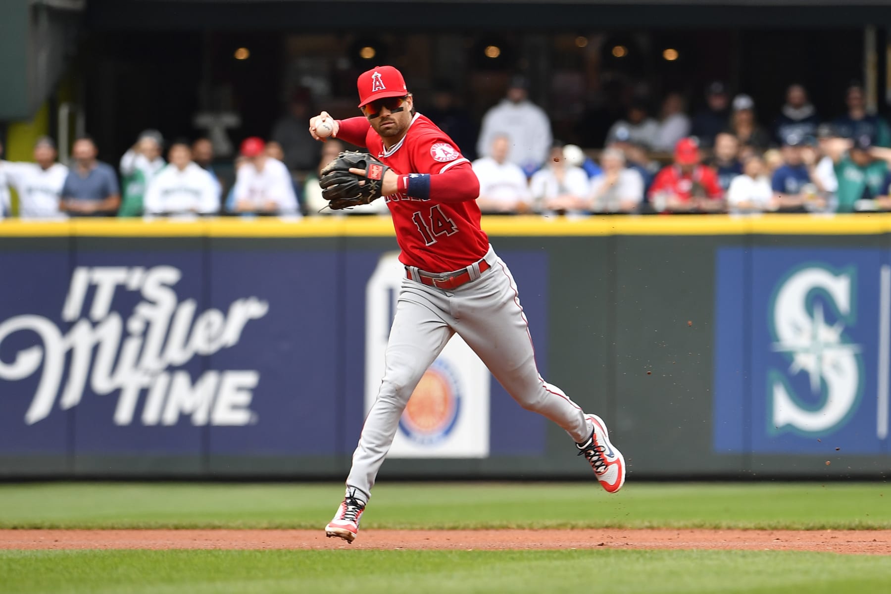 SEATTLE, WASHINGTON - JUNE 18: Tyler Wade #14 of the Los Angeles Angels throws to first base during the first inning against the Seattle Mariners at T-Mobile Park on June 18, 2022 in Seattle, Washington. (Photo by Alika Jenner/Getty Images)