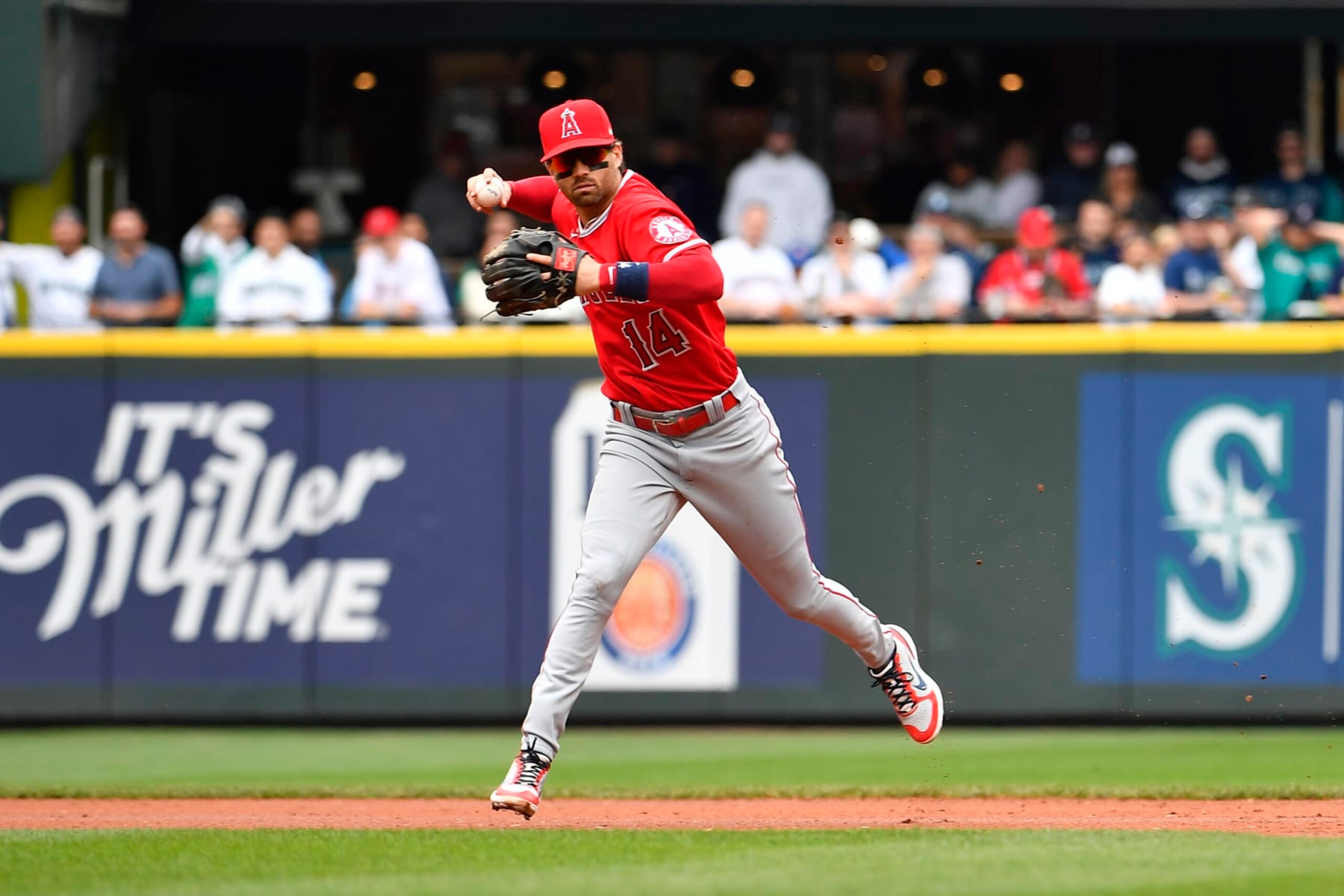 SEATTLE, WASHINGTON - JUNE 18: Tyler Wade #14 of the Los Angeles Angels throws to first base during the first inning against the Seattle Mariners at T-Mobile Park on June 18, 2022 in Seattle, Washington. (Photo by Alika Jenner/Getty Images)