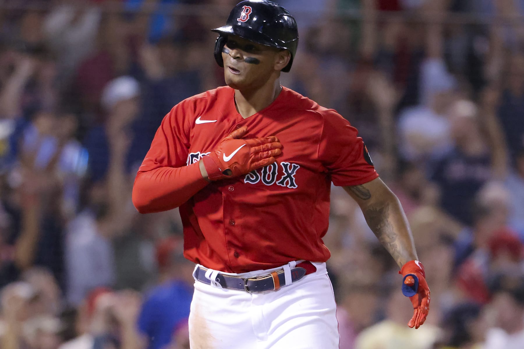 Boston, MA - July 6: Boston Red Sox Rafael Devers pounds his chest looking into his dugout after hitting a three run home run against the New York Yankees during fifth inning MLB action at Fenway Park. (Photo by Matthew J. Lee/The Boston Globe via Getty Images)