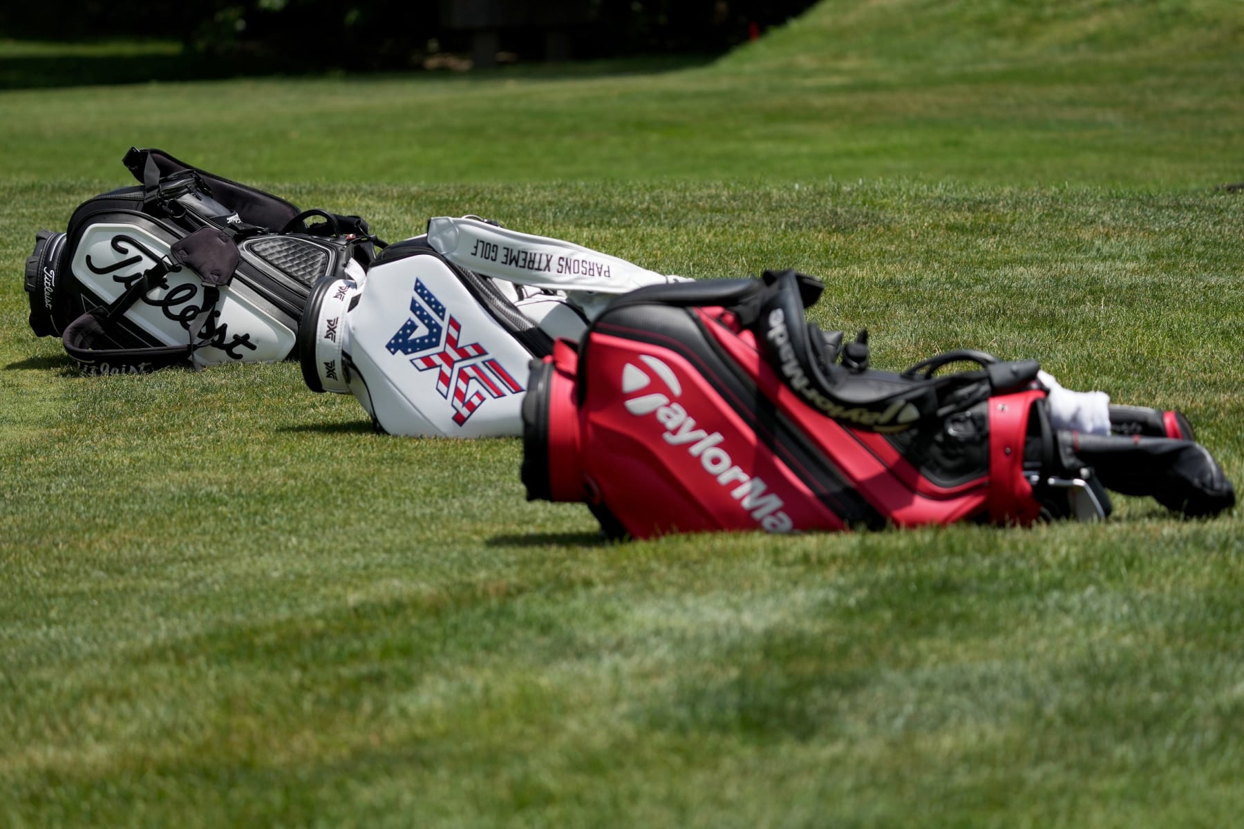 WICHITA, KANSAS - JUNE 17: Golf bags sit on the 13th green during the second round of the Wichita Open Benefitting KU Wichita Pediatrics at Crestview Country Club on June 17, 2022 in Wichita, Kansas. (Photo by Dylan Buell/Getty Images)
