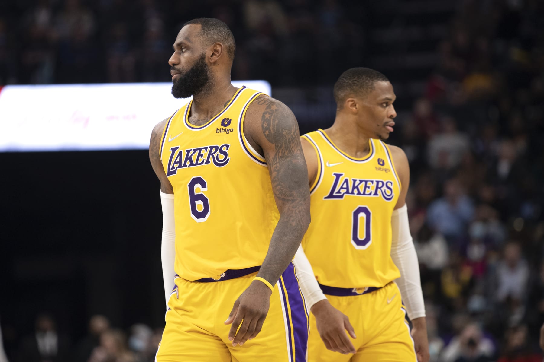 Los Angeles Lakers forward LeBron James (6) and guard Russell Westbrook move in different directions during a break in game action in the second half of an NBA basketball game against the Memphis Grizzlies Wednesday, Dec. 29, 2021, in Memphis, Tenn. (AP Photo/Nikki Boertman)
