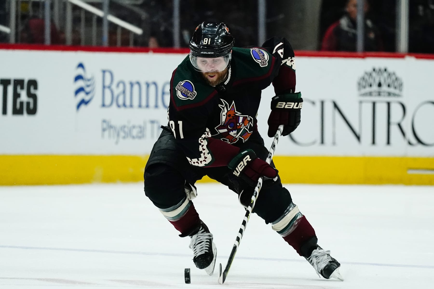 Arizona Coyotes right wing Phil Kessel skates with the puck against the St. Louis Blues during the second period of an NHL hockey game Saturday, April 23, 2022, in Glendale, Ariz. The Blues won 5-4 in overtime. (AP Photo/Ross D. Franklin)
