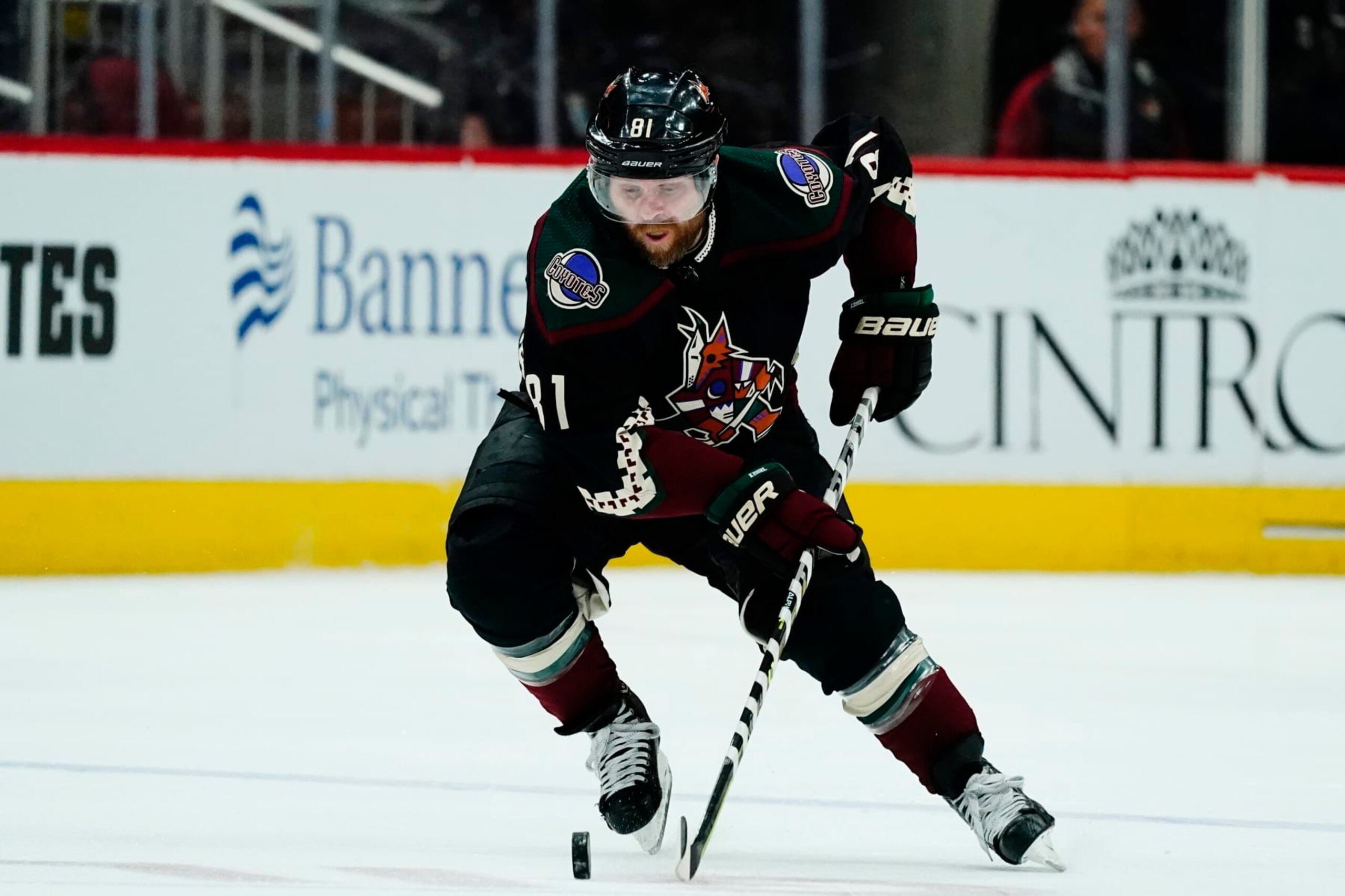 Arizona Coyotes right wing Phil Kessel skates with the puck against the St. Louis Blues during the second period of an NHL hockey game Saturday, April 23, 2022, in Glendale, Ariz. The Blues won 5-4 in overtime. (AP Photo/Ross D. Franklin)