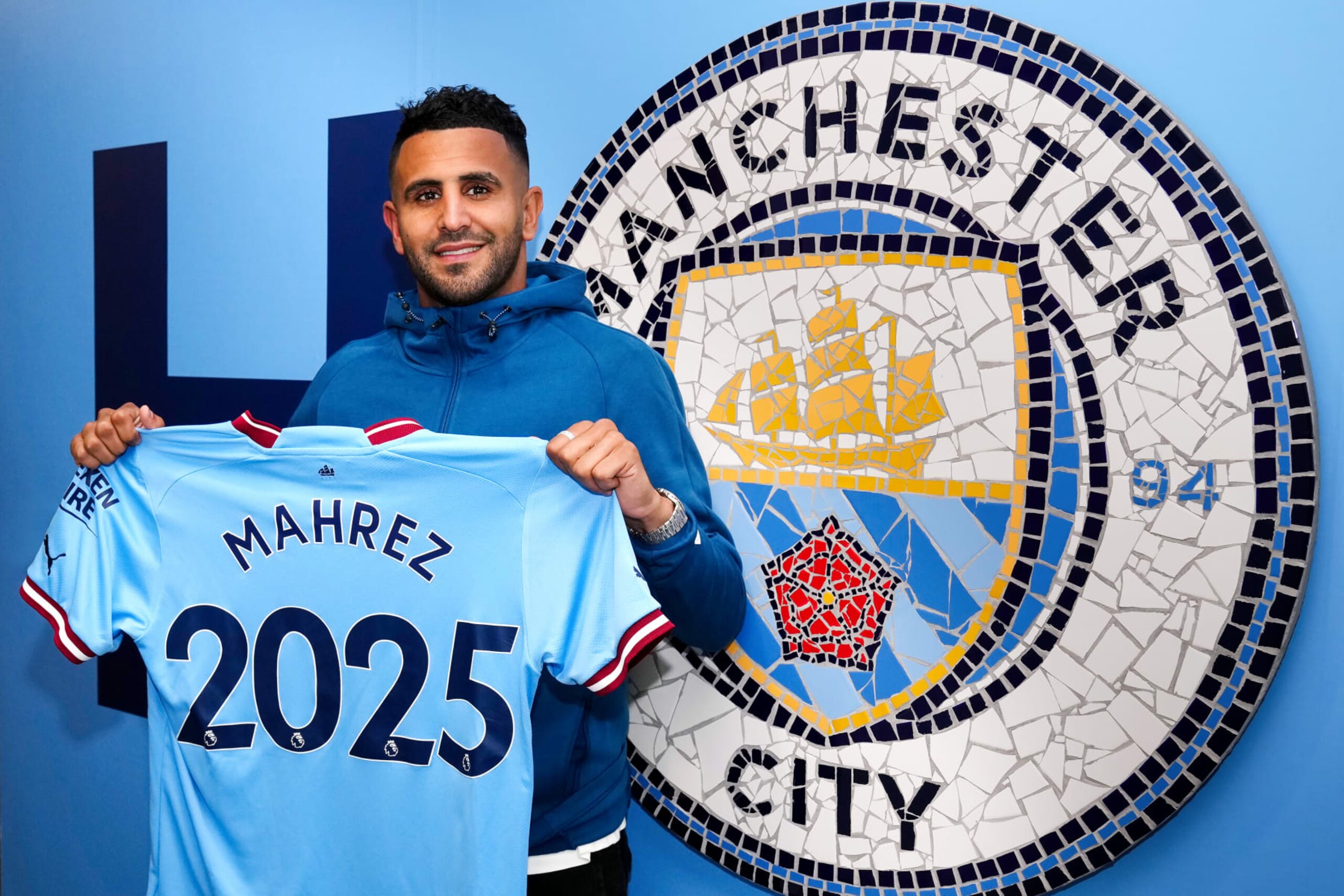 MANCHESTER, ENGLAND - JULY 15: Riyad Mahrez of Manchester City signs a contract extension at Manchester City Academy Stadium on July 15, 2022 in Manchester, England. (Photo by Matt McNulty - Manchester City/Manchester City FC via Getty Images)