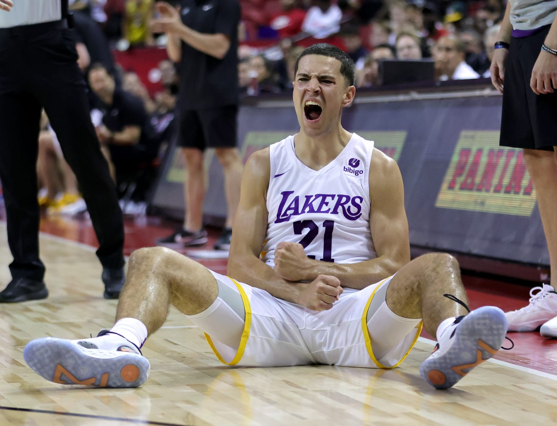 LAS VEGAS, NEVADA - JULY 10: Cole Swider #21 of the Los Angeles Lakers reacts after hitting a 3-pointer and getting a foul call against the Charlotte Hornets during the 2022 NBA Summer League at the Thomas & Mack Center on July 10, 2022 in Las Vegas, Nevada. NOTE TO USER: User expressly acknowledges and agrees that, by downloading and or using this photograph, User is consenting to the terms and conditions of the Getty Images License Agreement. (Photo by Ethan Miller/Getty Images)