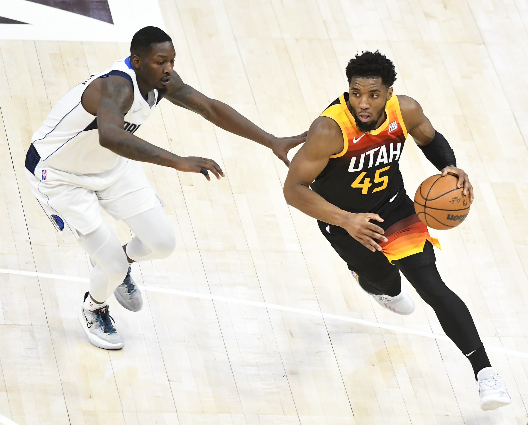 SALT LAKE CITY, UTAH - APRIL 28: Donovan Mitchell #45 of the Utah Jazz drives around Dorian Finney-Smith #10 of the Dallas Mavericks during the first half of Game 6 of the Western Conference First Round Playoffs at Vivint Smart Home Arena on April 28, 2022 in Salt Lake City, Utah. NOTE TO USER: User expressly acknowledges and agrees that, by downloading and/or using this Photograph, user is consenting to the terms and conditions of the Getty Images License Agreement. (Photo by Alex Goodlett/Getty Images)
