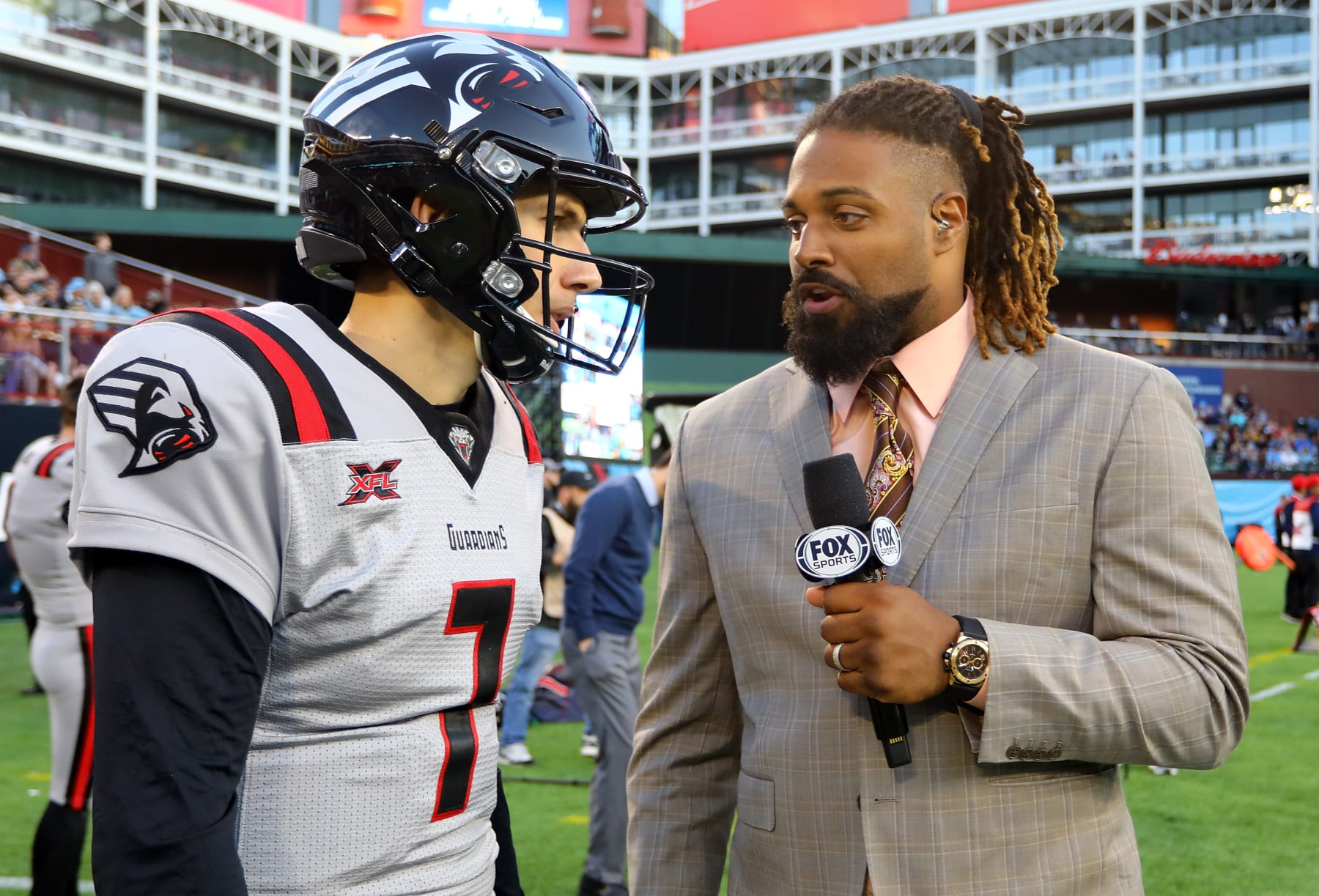ARLINGTON, TEXAS - MARCH 07: Luis Perez #7 of the New York Guardians is interviewed by FOX sideline reporter Cam Jordan at an XFL football game against the Dallas Renegades on March 07, 2020 in Arlington, Texas. (Photo by Richard Rodriguez/Getty Images)