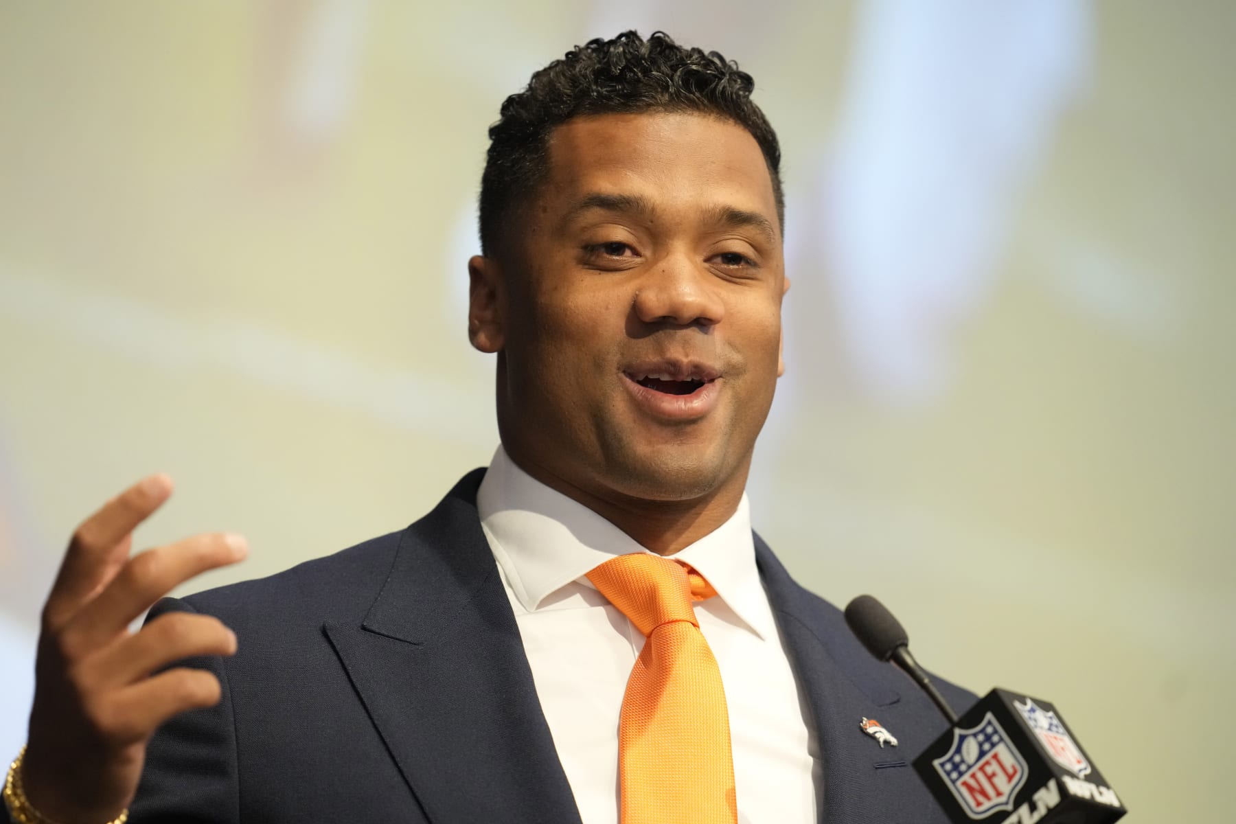 Denver Broncos new starting quarterback Russell Wilson speaks during a news conference Wednesday, March 16, 2022, at the team's headquarters in Englewood, Colo. (AP Photo/David Zalubowski)