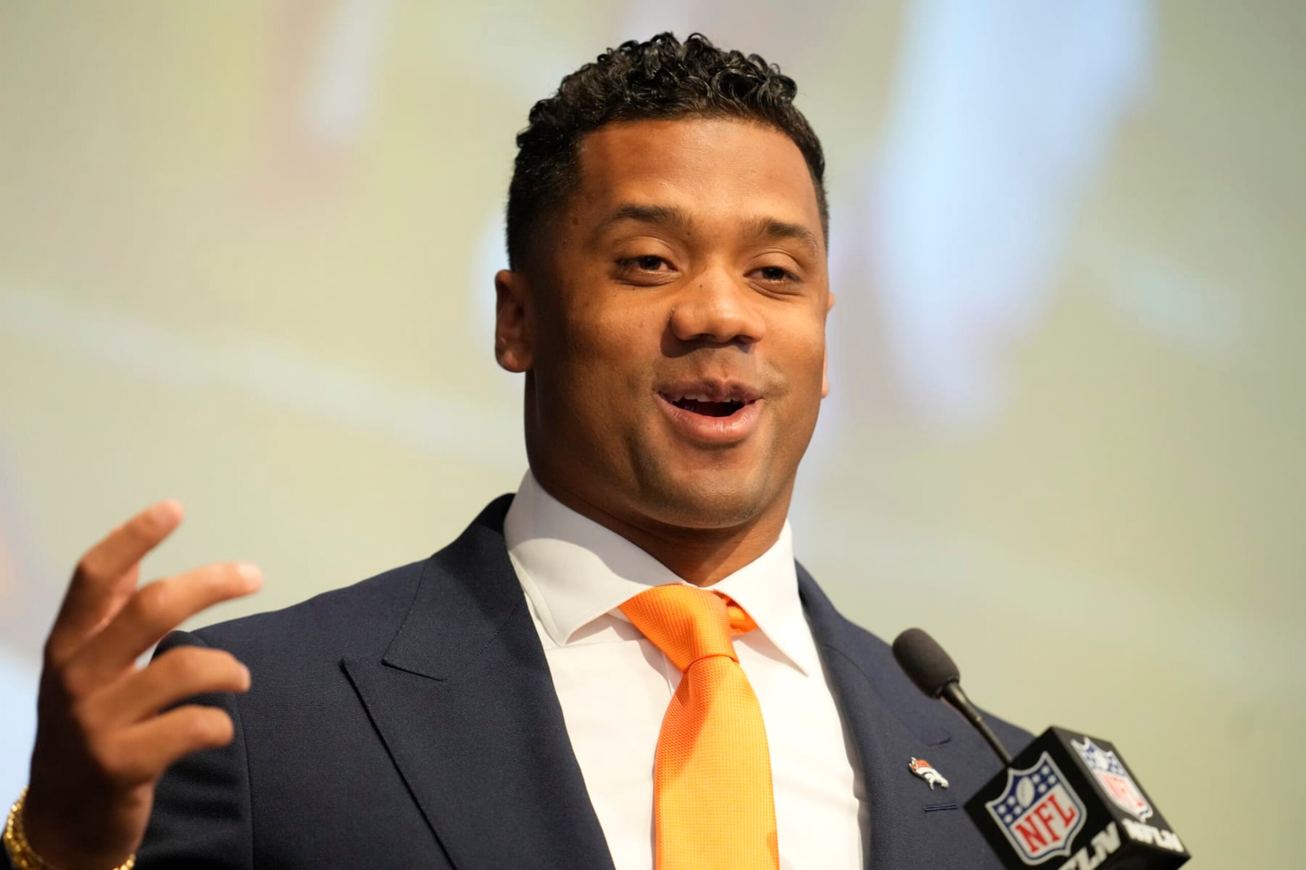 Denver Broncos new starting quarterback Russell Wilson speaks during a news conference Wednesday, March 16, 2022, at the team's headquarters in Englewood, Colo. (AP Photo/David Zalubowski)