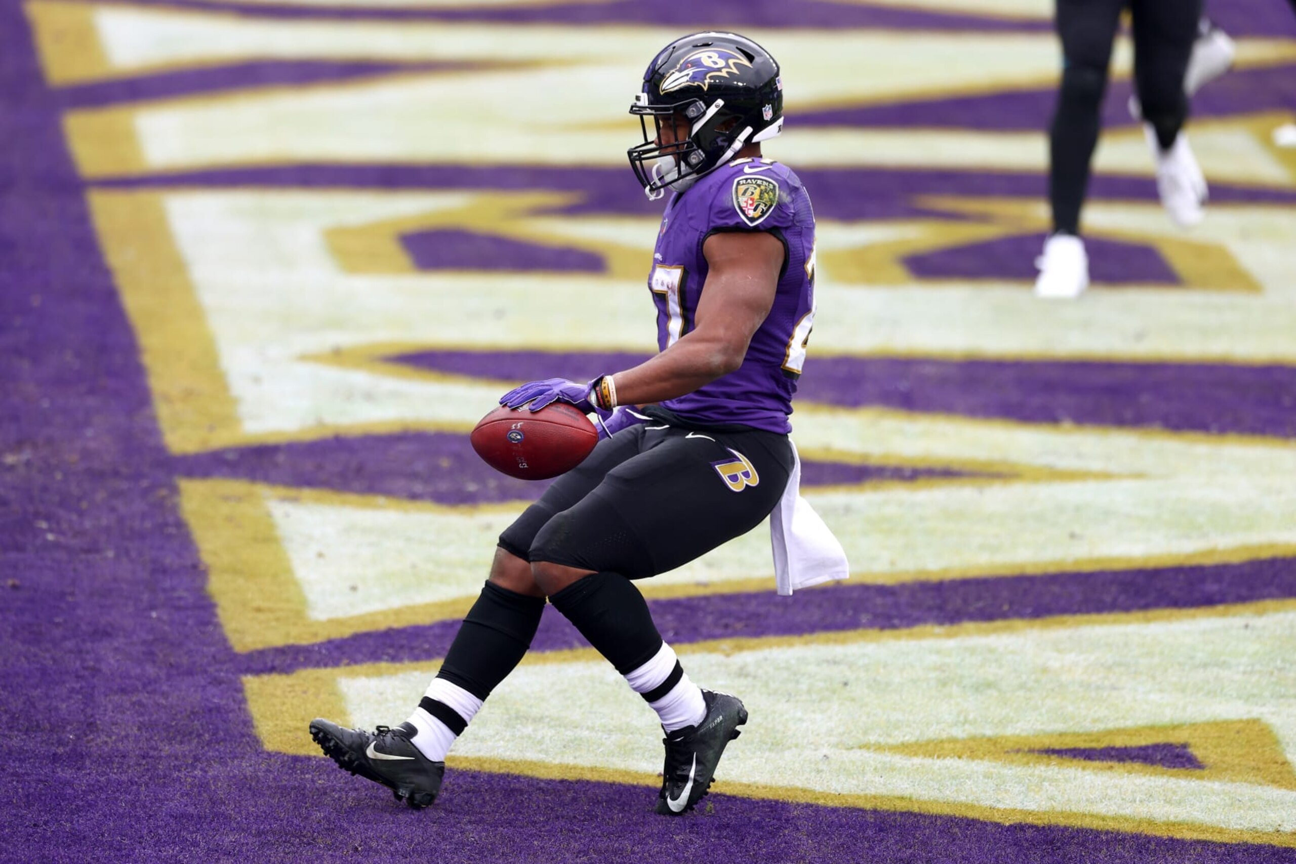 BALTIMORE, MARYLAND - DECEMBER 20: Running back J.K. Dobbins #27 of the Baltimore Ravens carries the ball in for a touchdown during the second quarter of their game against the Jacksonville Jaguars at M&T Bank Stadium on December 20, 2020 in Baltimore, Maryland. (Photo by Todd Olszewski/Getty Images)