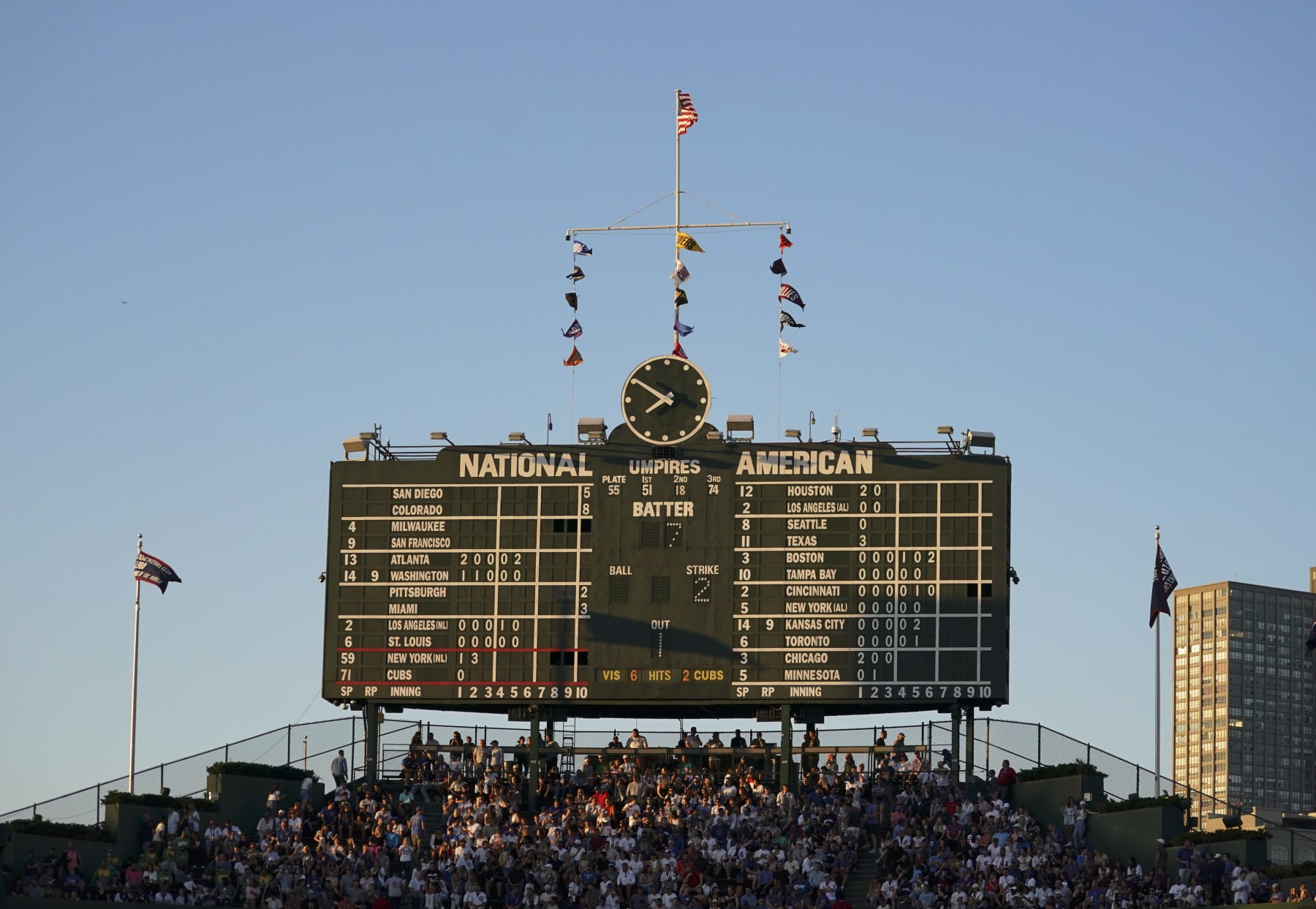 CHICAGO, ILLINOIS - JULY 14: A general view of the old scoreboard bathed in sun light during a game between the Chicago Cubs and the New York Mets at Wrigley Field on July 14, 2022 in Chicago, Illinois. (Photo by Nuccio DiNuzzo/Getty Images)