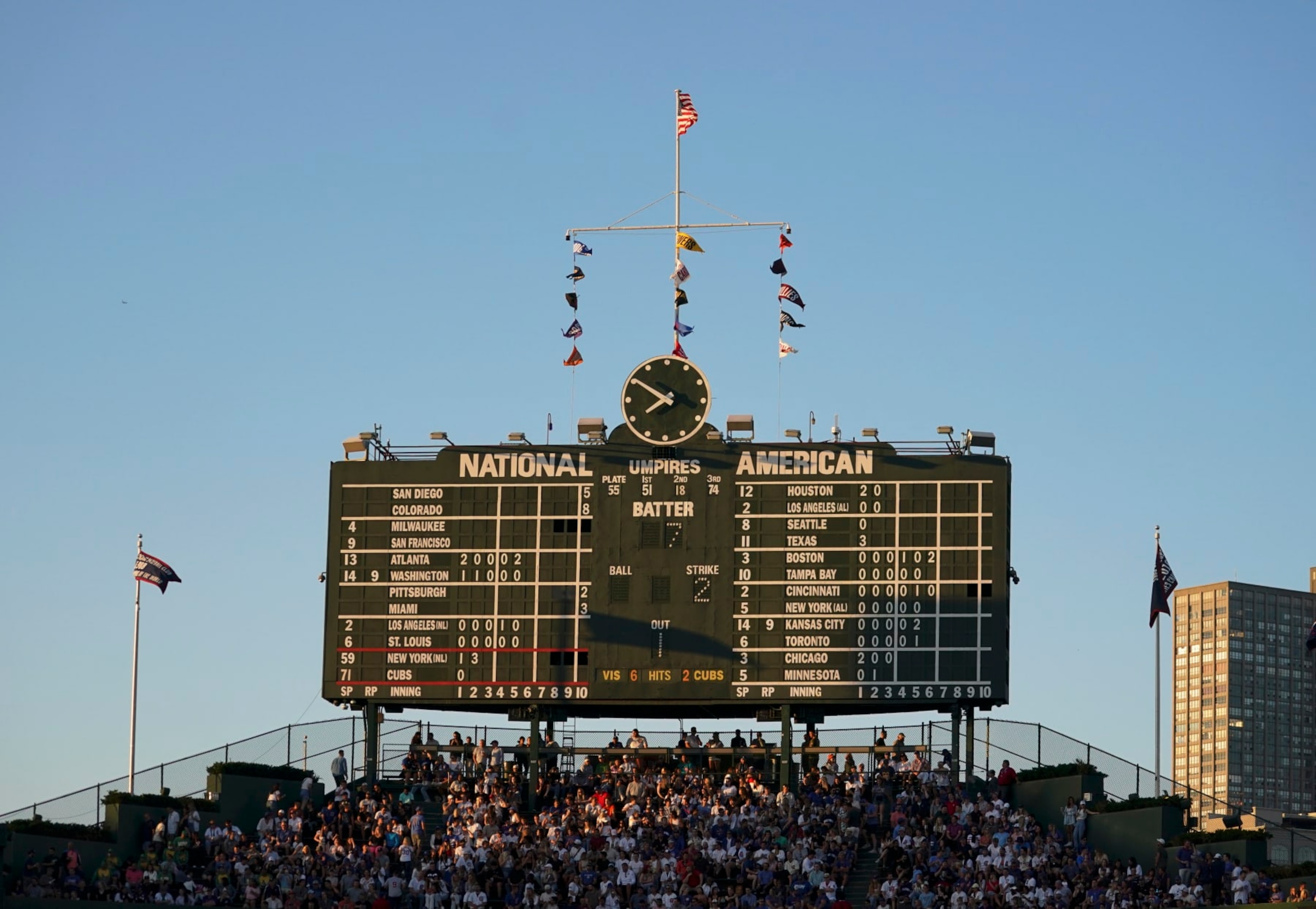 CHICAGO, ILLINOIS - JULY 14: A general view of the old scoreboard bathed in sun light during a game between the Chicago Cubs and the New York Mets at Wrigley Field on July 14, 2022 in Chicago, Illinois. (Photo by Nuccio DiNuzzo/Getty Images)