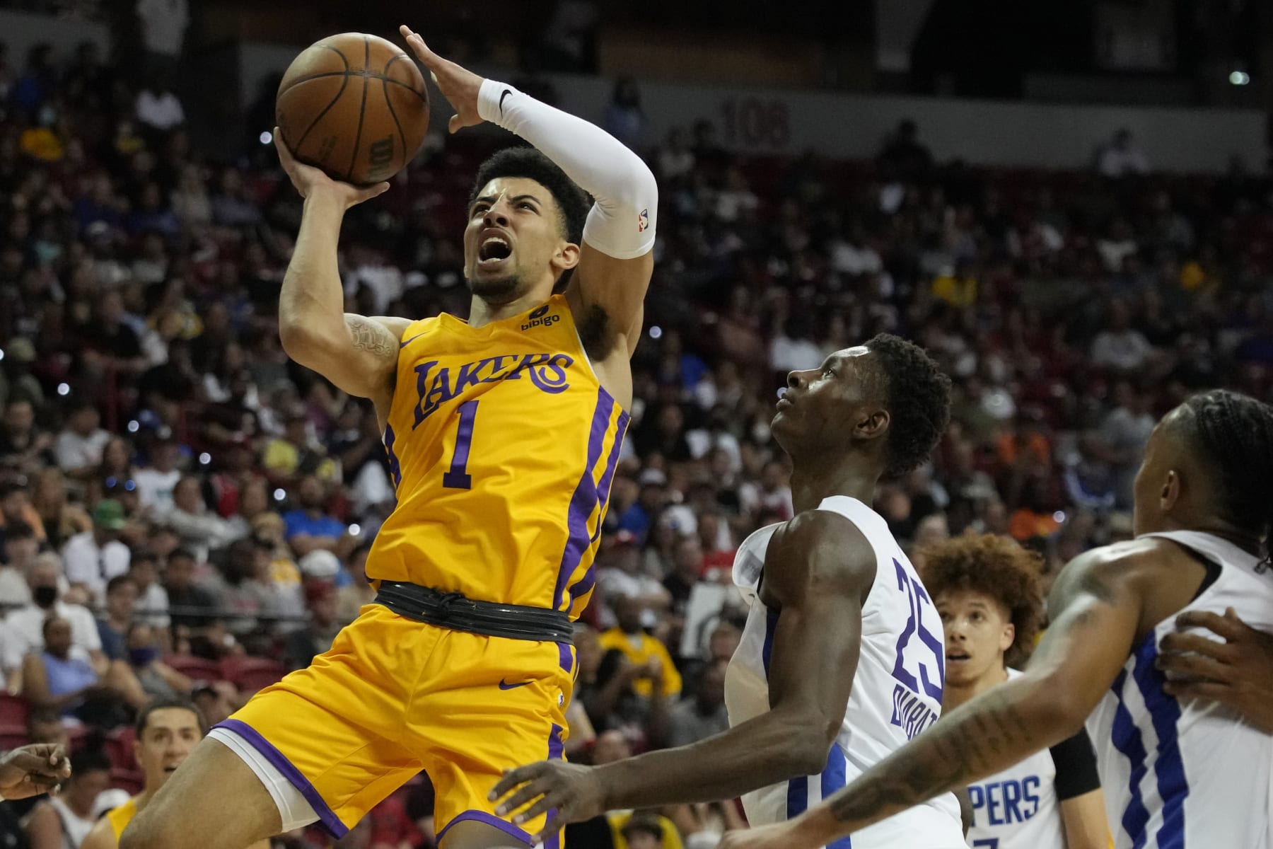 Los Angeles Lakers' Scotty Pippen Jr. shoots over Los Angeles Clippers' Moussa Diabate during the first half an NBA summer league basketball game Tuesday, July 12, 2022, in Las Vegas. (AP Photo/John Locher)