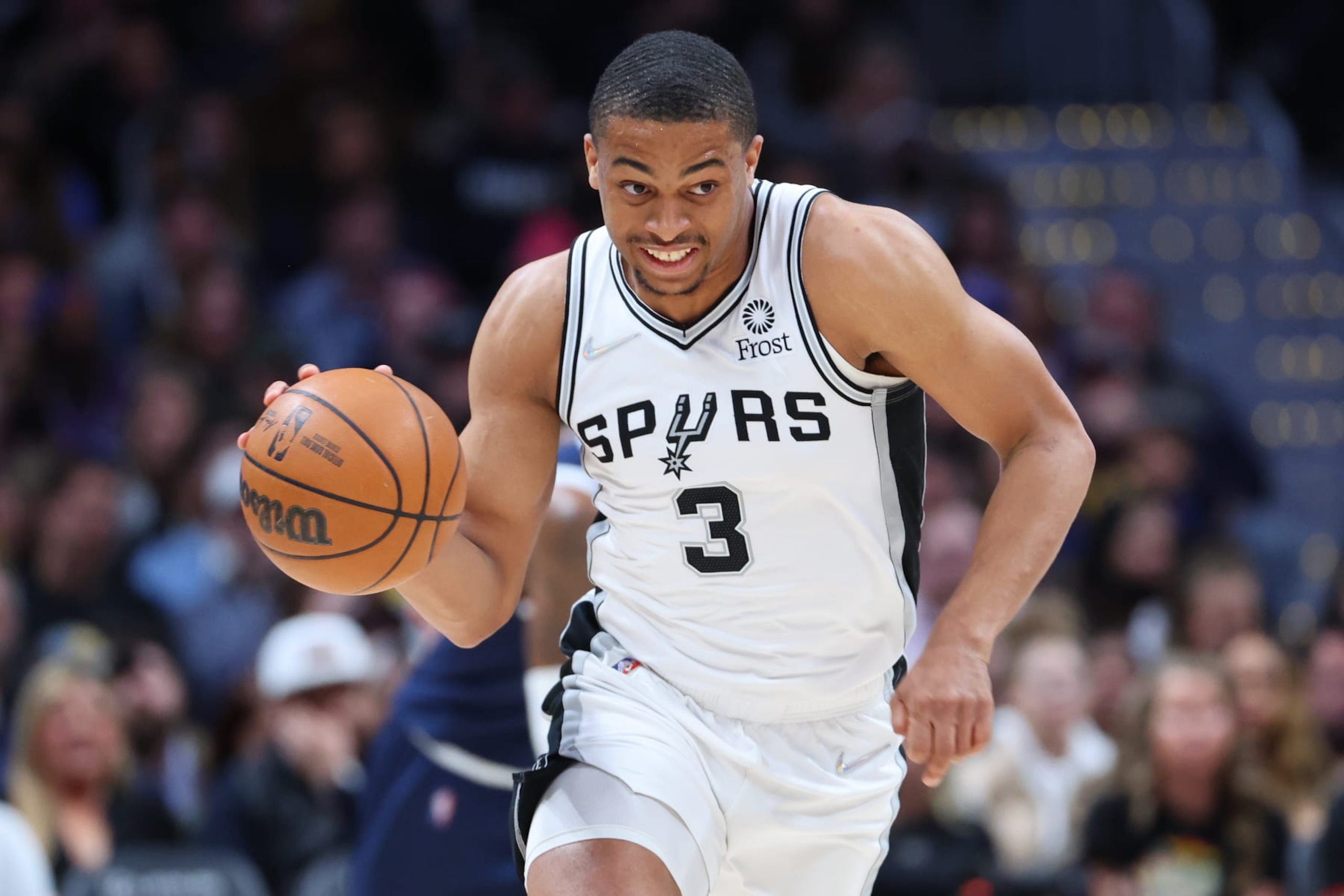 DENVER, CO - APRIL 05: Keldon Johnson #3 of the San Antonio Spurs handles the ball against the Denver Nuggets during the first quarter at Ball Arena on April 5, 2022 in Denver, Colorado.  NOTE TO USER: User expressly acknowledges and agrees that, by downloading and or using this photograph, User is consenting to the terms and conditions of the Getty Images License Agreement. (Photo by C. Morgan Engel/Getty Images)