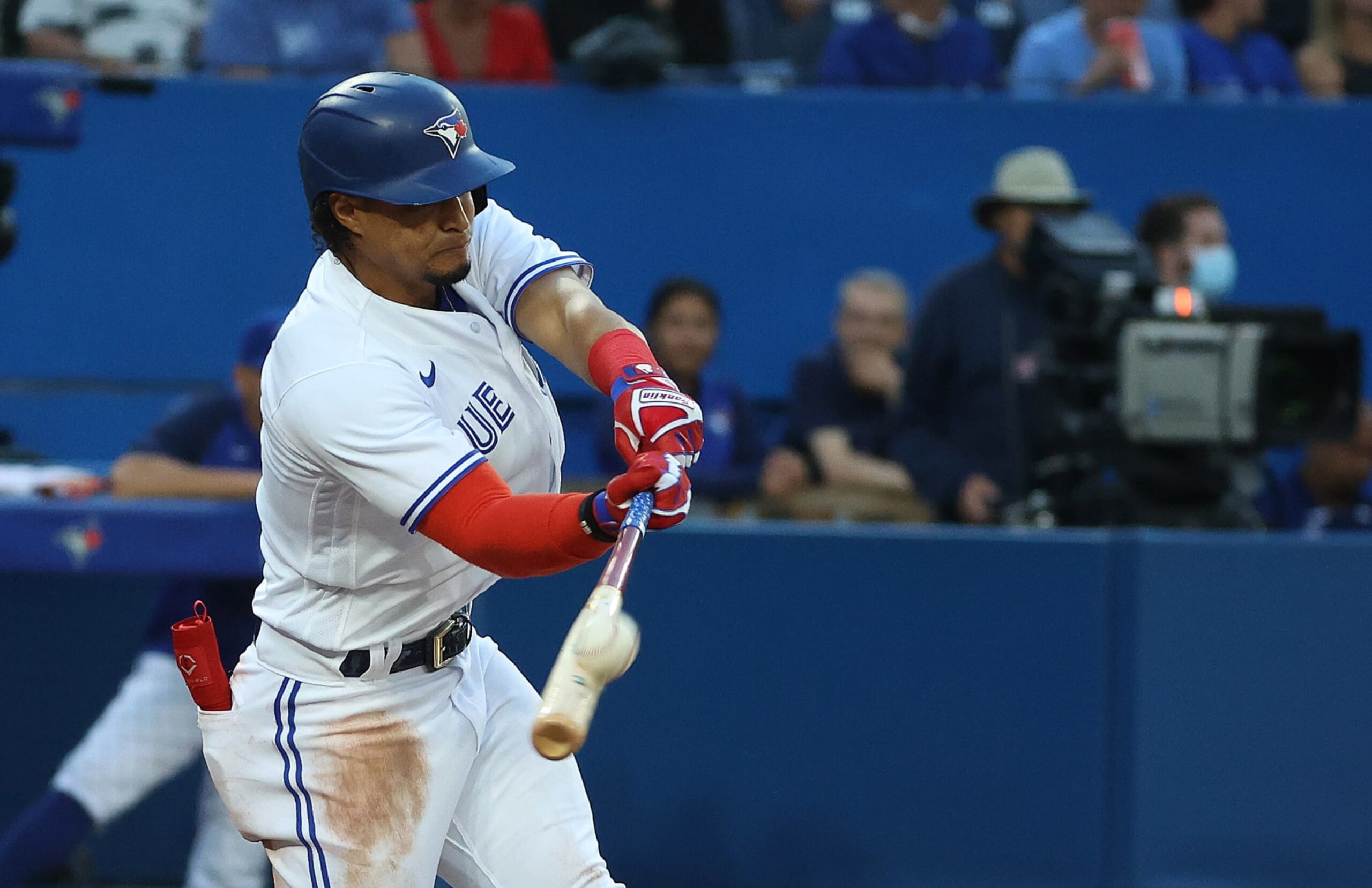 TORONTO, ON - JULY 13  -  Toronto Blue Jays second baseman Santiago Espinal (5) gets a hit.  Toronto Blue Jays bench coach John Schneider becomes interim manager after the Toronto Blue Jays have fired manager Charlie Montoyo, earlier in the day. The Toronto Blue Jays defeat the Philadelphia Phillies 8-2 at Rogers Centre in Toronto. July 13, 2022.        (Steve Russell/Toronto Star via Getty Images)