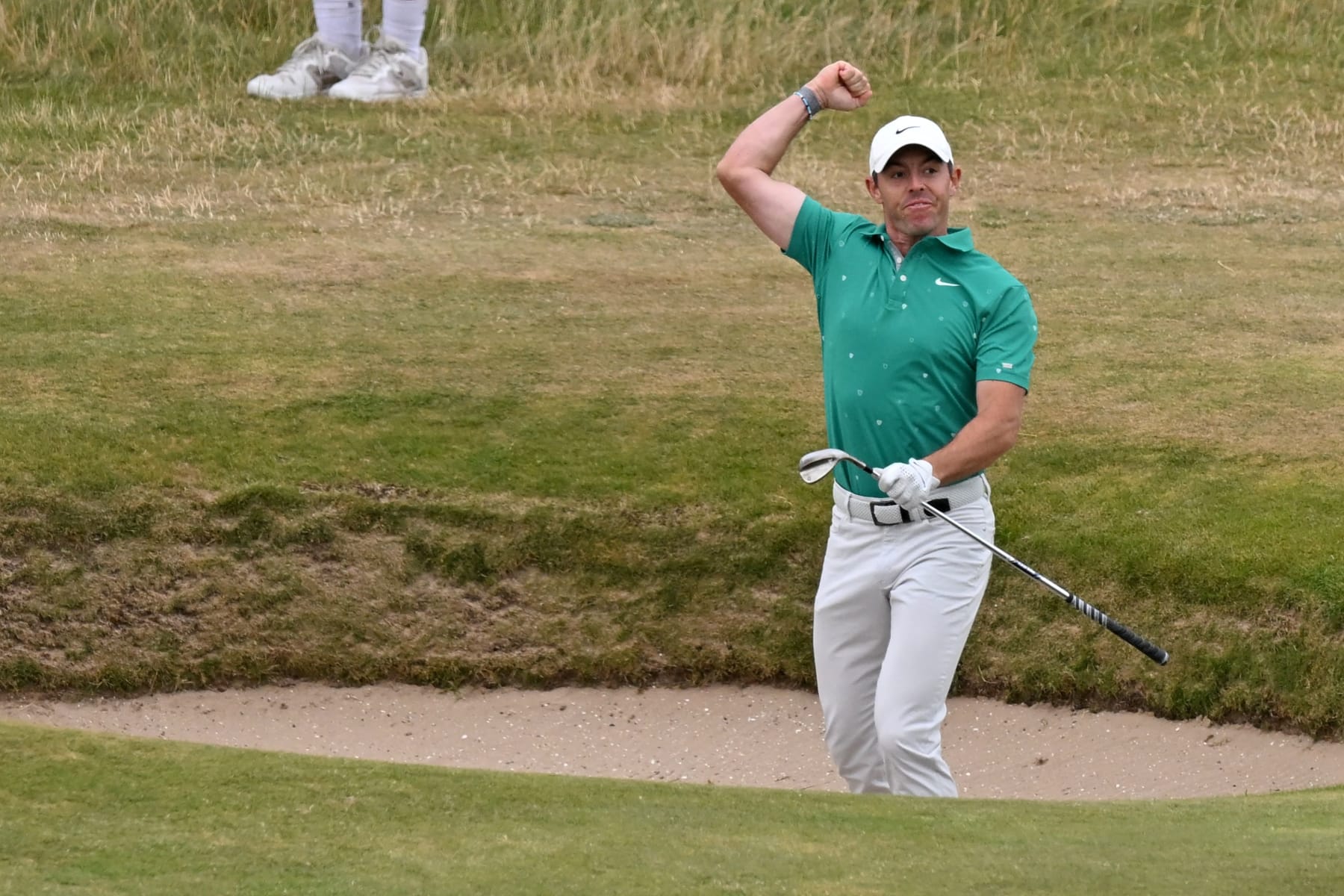 Northern Ireland's Rory McIlroy celebrates after holing a bunker shot for an eagle on the 10th hole during his third round on day 3 of The 150th British Open Golf Championship on The Old Course at St Andrews in Scotland on July 16, 2022. - RESTRICTED TO EDITORIAL USE (Photo by Glyn KIRK / AFP) / RESTRICTED TO EDITORIAL USE (Photo by GLYN KIRK/AFP via Getty Images) Northern Ireland's Rory McIlroy celebrates after holing a bunker shot for an eagle on the 10th hole during his third round on day 3 of The 150th British Open Golf Championship on The Old Course at St Andrews in Scotland on July 16, 2022. - RESTRICTED TO EDITORIAL USE (Photo by Glyn KIRK / AFP) / RESTRICTED TO EDITORIAL USE (Photo by GLYN KIRK/AFP via Getty Images)