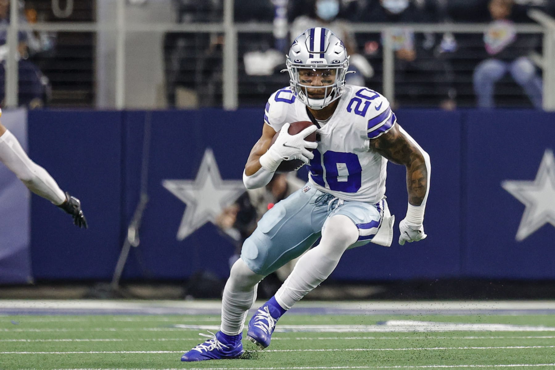 ARLINGTON, TX - DECEMBER 26: Dallas Cowboys running back Tony Pollard (20) runs for a first down during the game between the Dallas Cowboys and the Washington Football Team on December 26, 2021 at AT&T Stadium in Arlington, Texas. (Photo by Matthew Pearce/Icon Sportswire via Getty Images)