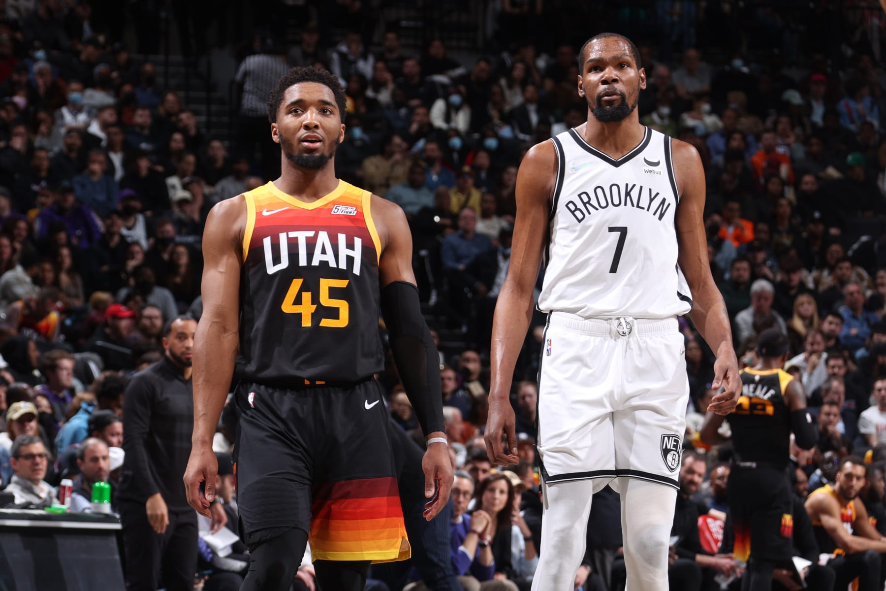 BROOKLYN, NY - MARCH 21: Donovan Mitchell #45 of the Utah Jazz and Kevin Durant #7 of the Brooklyn Nets look on during the game on March 21, 2022 at Barclays Center in Brooklyn, New York. NOTE TO USER: User expressly acknowledges and agrees that, by downloading and or using this Photograph, user is consenting to the terms and conditions of the Getty Images License Agreement. Mandatory Copyright Notice: Copyright 2022 NBAE (Photo by Nathaniel S. Butler/NBAE via Getty Images)