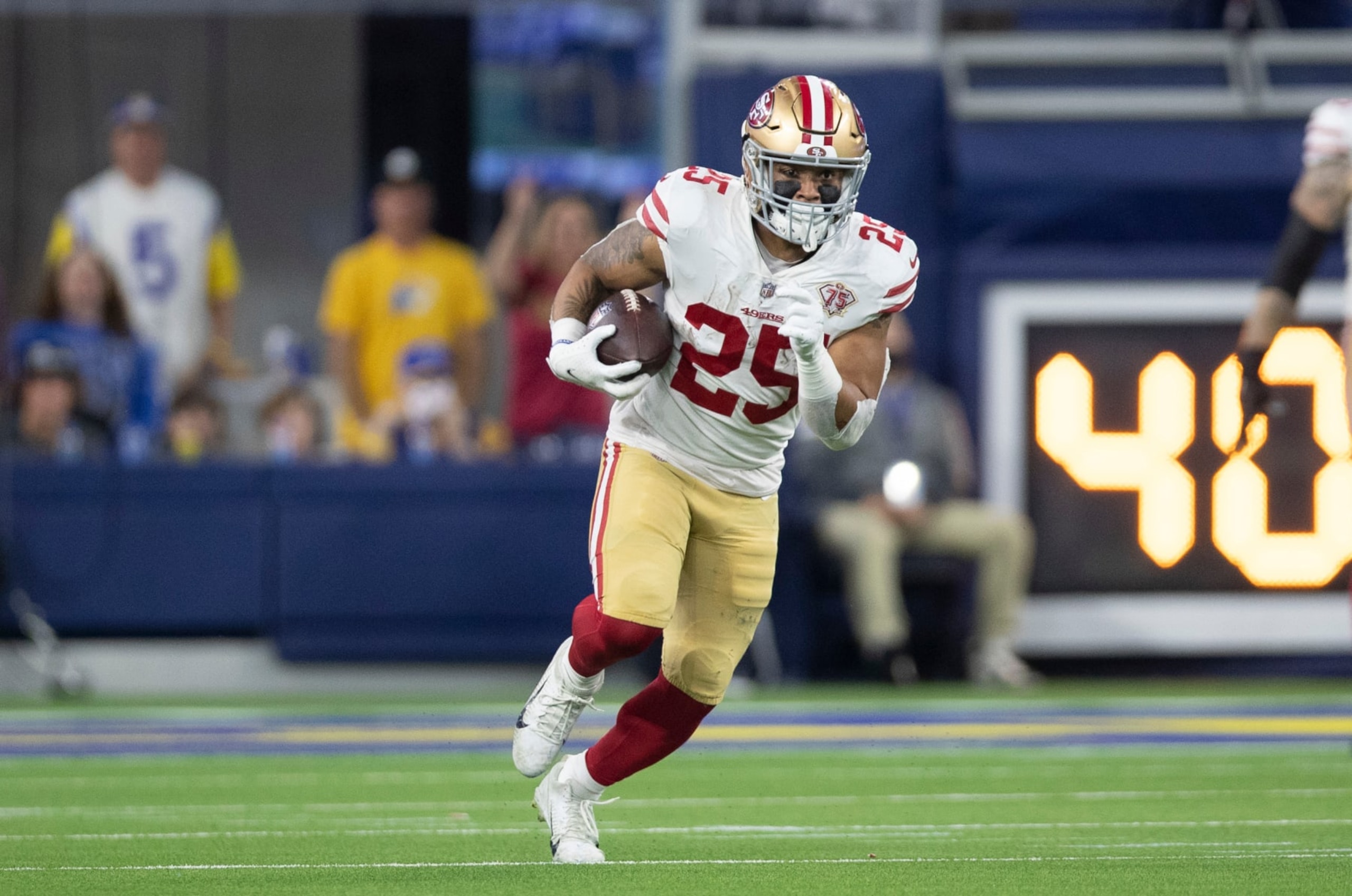 INGLEWOOD, CA - JANUARY 30: Elijah Mitchell #25 of the San Francisco 49ers runs after making a catch during the game against the Los Angeles Rams at SoFi Stadium on January 30, 2022 in Inglewood, California. The Rams defeated the 49ers 20-17. (Photo by Michael Zagaris/San Francisco 49ers/Getty Images)