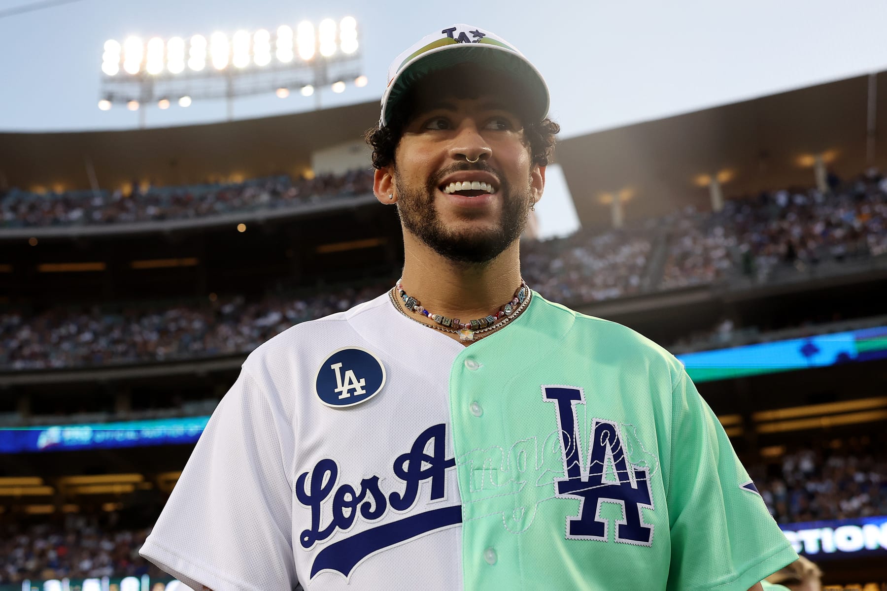 LOS ANGELES, CA - JULY 16:  Bad Bunny looks on during the MGM All-Star Celebrity Softball Game at Dodger Stadium on Saturday, July 16, 2022 in Los Angeles, California. (Photo by Mary DeCicco/MLB Photos via Getty Images)