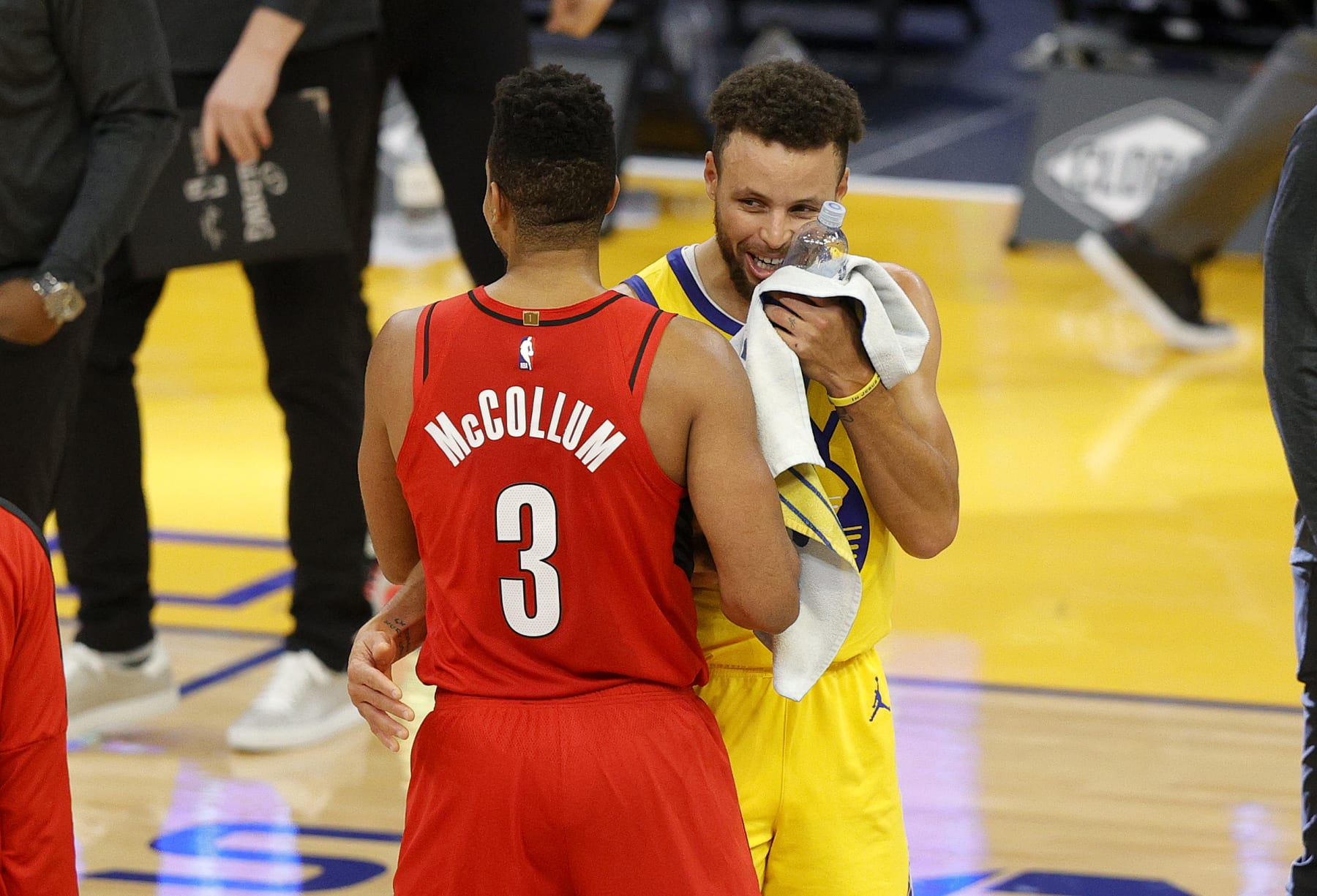 SAN FRANCISCO, CALIFORNIA - JANUARY 03:  Stephen Curry #30 of the Golden State Warriors is congratulated by CJ McCollum #3 of the Portland Trail Blazers after Curry scored a career-high 62 points against the Portland Trail Blazers at Chase Center on January 03, 2021 in San Francisco, California. NOTE TO USER: User expressly acknowledges and agrees that, by downloading and or using this photograph, User is consenting to the terms and conditions of the Getty Images License Agreement.  (Photo by Ezra Shaw/undefined)