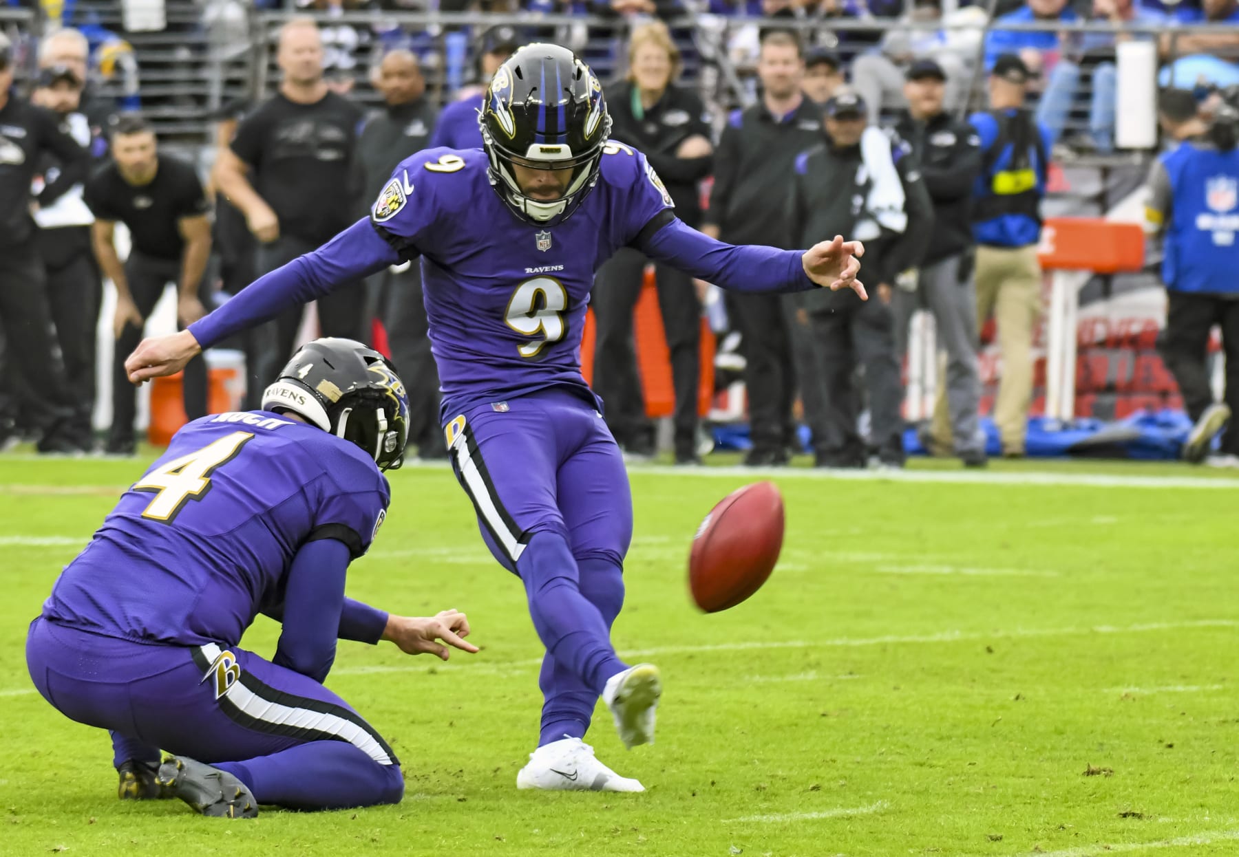 BALTIMORE, MD - JANUARY 02: Baltimore Ravens kicker Justin Tucker (9) kicks a field goal out of the hold of punter Sam Koch (4) during the Los Angeles Rams game versus the Baltimore Ravens on January 2, 2022 at M&T Bank Stadium in Baltimore, MD.  (Photo by Mark Goldman/Icon Sportswire via Getty Images)