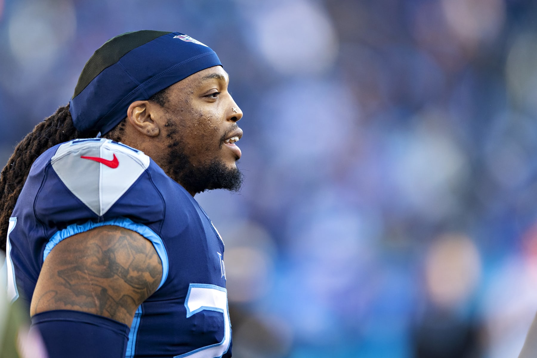 NASHVILLE, TENNESSEE - JANUARY 22: Derrick Henry #22 of the Tennessee Titans warms up before a game against the Cincinnati Bengals in the AFC Divisional Playoff game at Nissan Stadium on January 22, 2022 in Nashville, Tennessee. The Bengals defeated the Titans 19-16.  (Photo by Wesley Hitt/Getty Images)