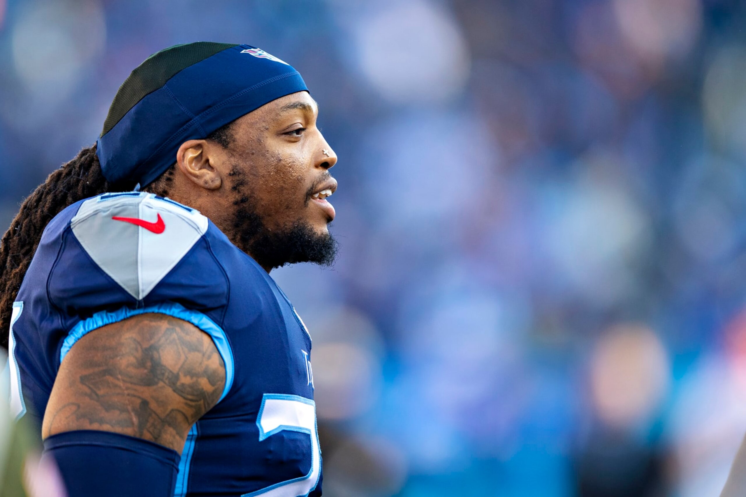 NASHVILLE, TENNESSEE - JANUARY 22: Derrick Henry #22 of the Tennessee Titans warms up before a game against the Cincinnati Bengals in the AFC Divisional Playoff game at Nissan Stadium on January 22, 2022 in Nashville, Tennessee. The Bengals defeated the Titans 19-16.  (Photo by Wesley Hitt/Getty Images)