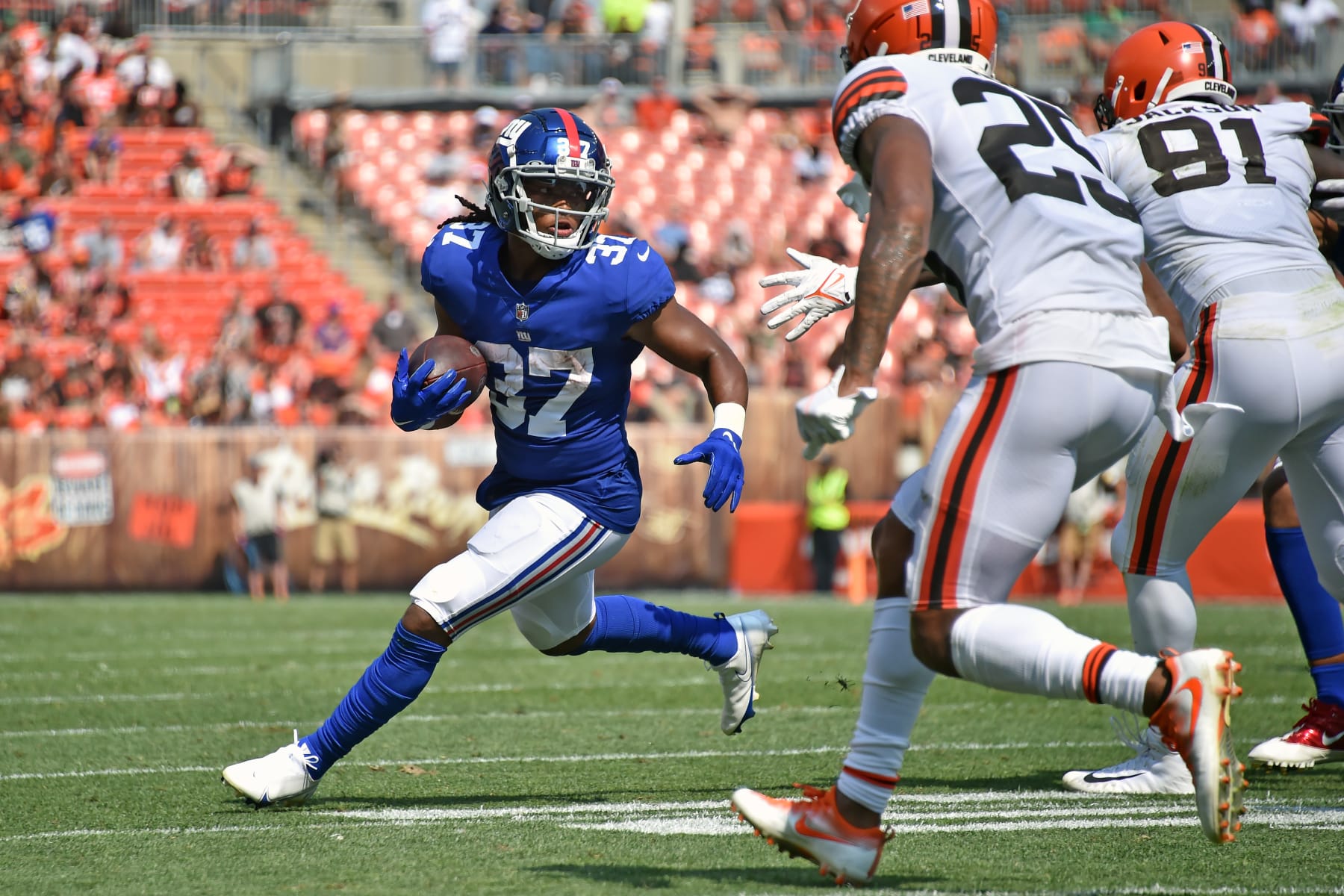 CLEVELAND, OHIO - AUGUST 22: Running back Gary Brightwell #37 of the New York Giants runs for a gain during the fourth quarter against the Cleveland Browns at FirstEnergy Stadium on August 22, 2021 in Cleveland, Ohio. The Browns defeated the Giants 17-13.  (Photo by Jason Miller/Getty Images)