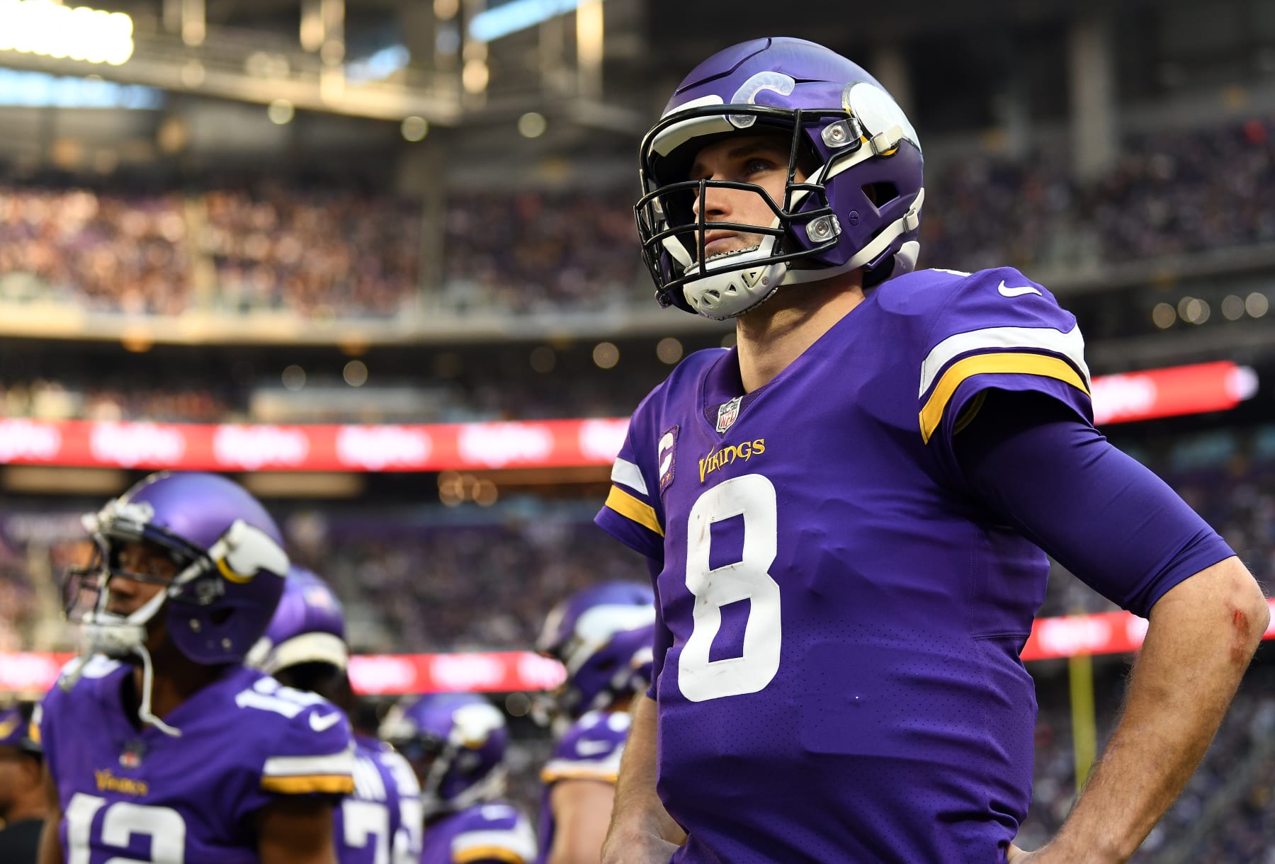 MINNEAPOLIS, MINNESOTA - JANUARY 09: Kirk Cousins #8 of the Minnesota Vikings looks on from the sidelines during the game against the Chicago Bears at U.S. Bank Stadium on January 09, 2022 in Minneapolis, Minnesota. (Photo by Stephen Maturen/Getty Images)