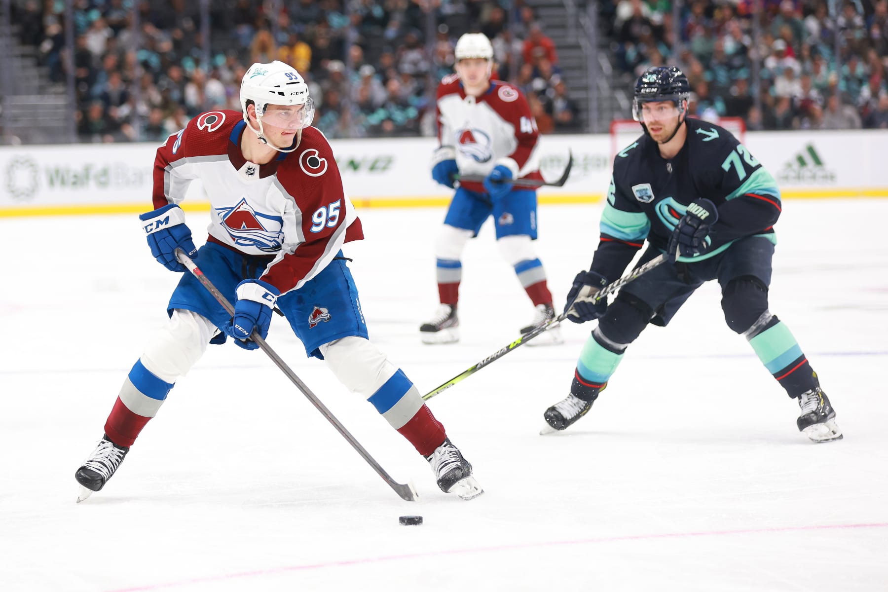 SEATTLE, WASHINGTON - APRIL 20: Andre Burakovsky #95 of the Colorado Avalanche skates against Joonas Donskoi #72 of the Seattle Kraken during the first period at Climate Pledge Arena on April 20, 2022 in Seattle, Washington. (Photo by Abbie Parr/NHLI via Getty Images)