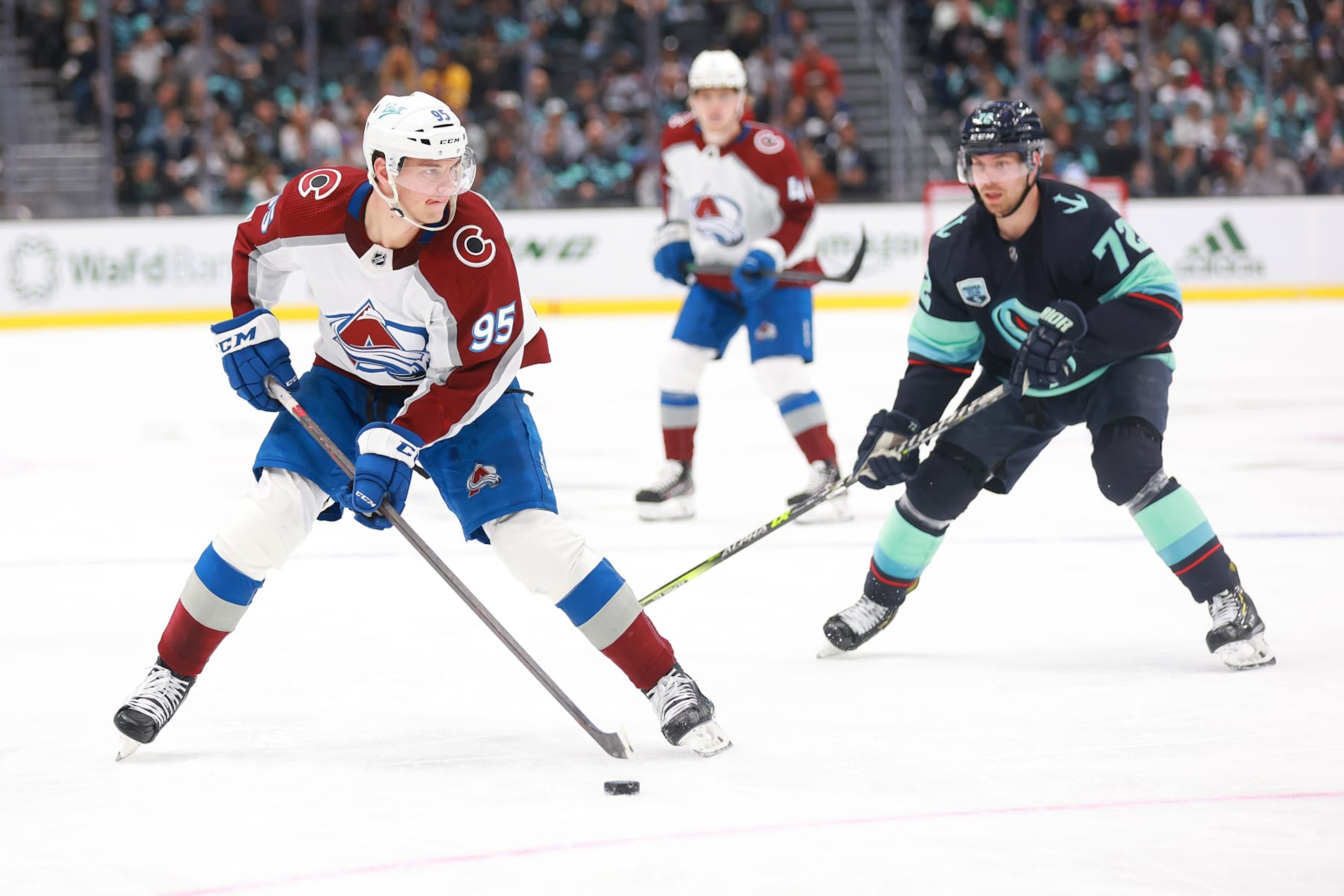 SEATTLE, WASHINGTON - APRIL 20: Andre Burakovsky #95 of the Colorado Avalanche skates against Joonas Donskoi #72 of the Seattle Kraken during the first period at Climate Pledge Arena on April 20, 2022 in Seattle, Washington. (Photo by Abbie Parr/NHLI via Getty Images)