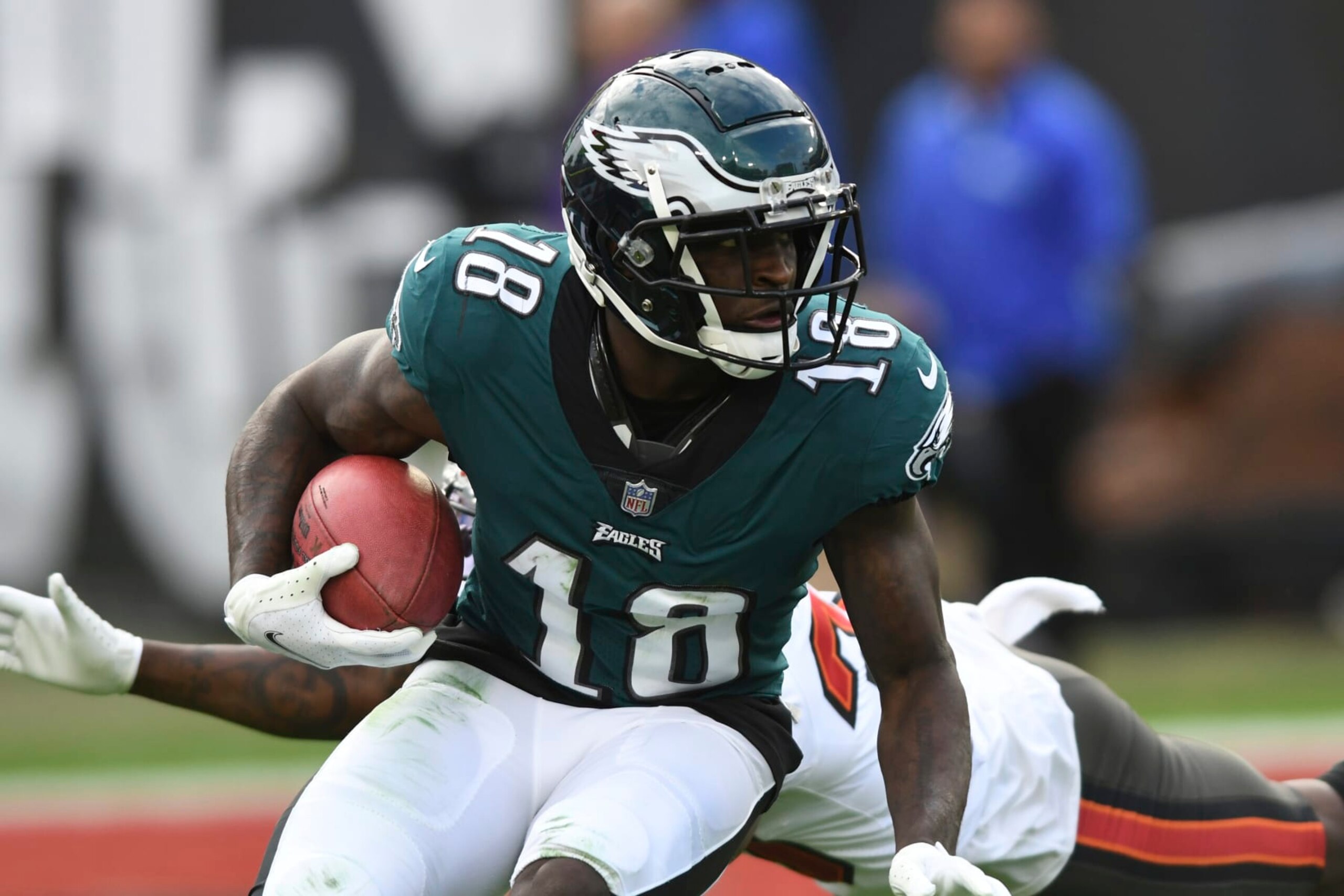 Philadelphia Eagles wide receiver Jalen Reagor (18) eludes a tackle by the Tampa Bay Buccaneers during the second half of an NFL wild-card football game Sunday, Jan. 16, 2022, in Tampa, Fla. (AP Photo/Jason Behnken)