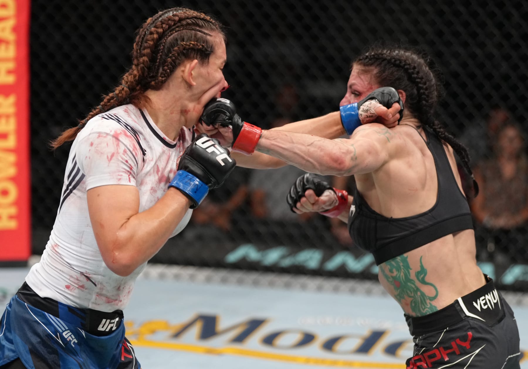 ELMONT, NEW YORK - JULY 16: (R-L) Lauren Murphy punches Miesha Tate in a flyweight fight during the UFC Fight Night event at UBS Arena on July 16, 2022 in Elmont, New York. (Photo by Jeff Bottari/Zuffa LLC)