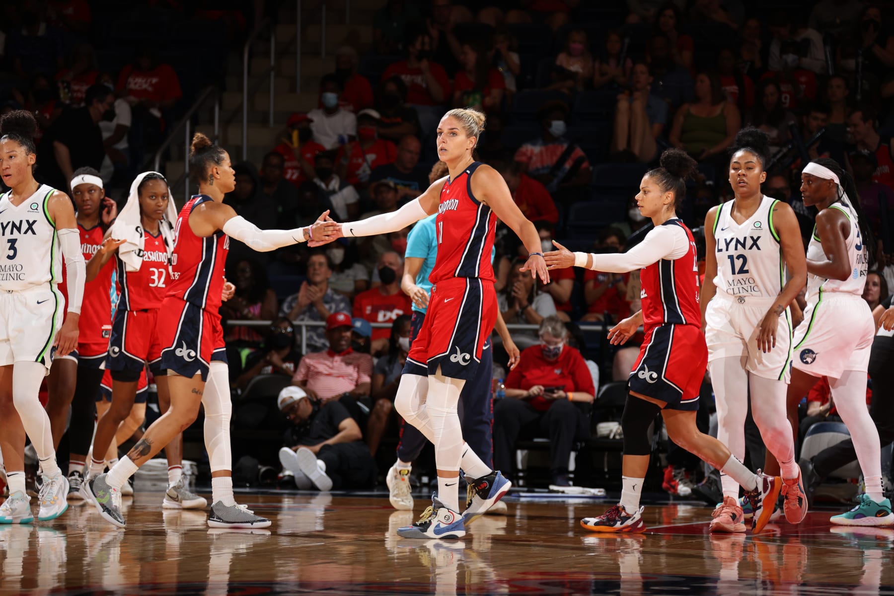 WASHINGTON, DC - JULY 17: Elena Delle Donne #11 of the Washington Mystics high fives Natasha Cloud #9 on July 17, 2022 at Entertainment & Sports Arena in Washington, DC. NOTE TO USER: User expressly acknowledges and agrees that, by downloading and or using this Photograph, user is consenting to the terms and conditions of the Getty Images License Agreement. Mandatory Copyright Notice: Copyright 2022 NBAE (Photo by Stephen Gosling/NBAE via Getty Images)