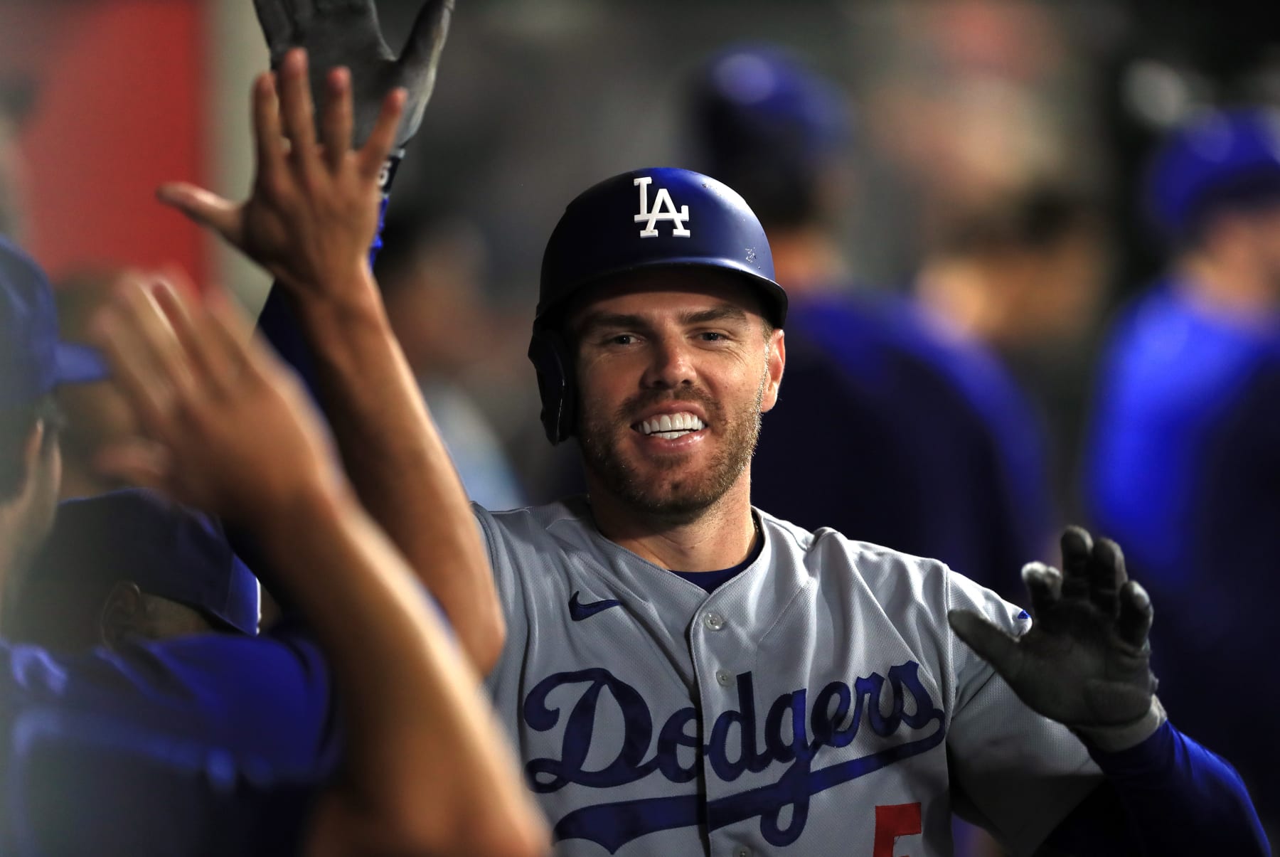 ANAHEIM, CALIFORNIA - JULY 16: Freddie Freeman #5 the Los Angeles Dodgers celebrates in the dugout after hitting a homerun recording his 1000th career RBI in the 5th inning against the Los Angeles Angels  at Angel Stadium of Anaheim on July 16, 2022 in Anaheim, California. (Photo by Kent Horner/Getty Images)