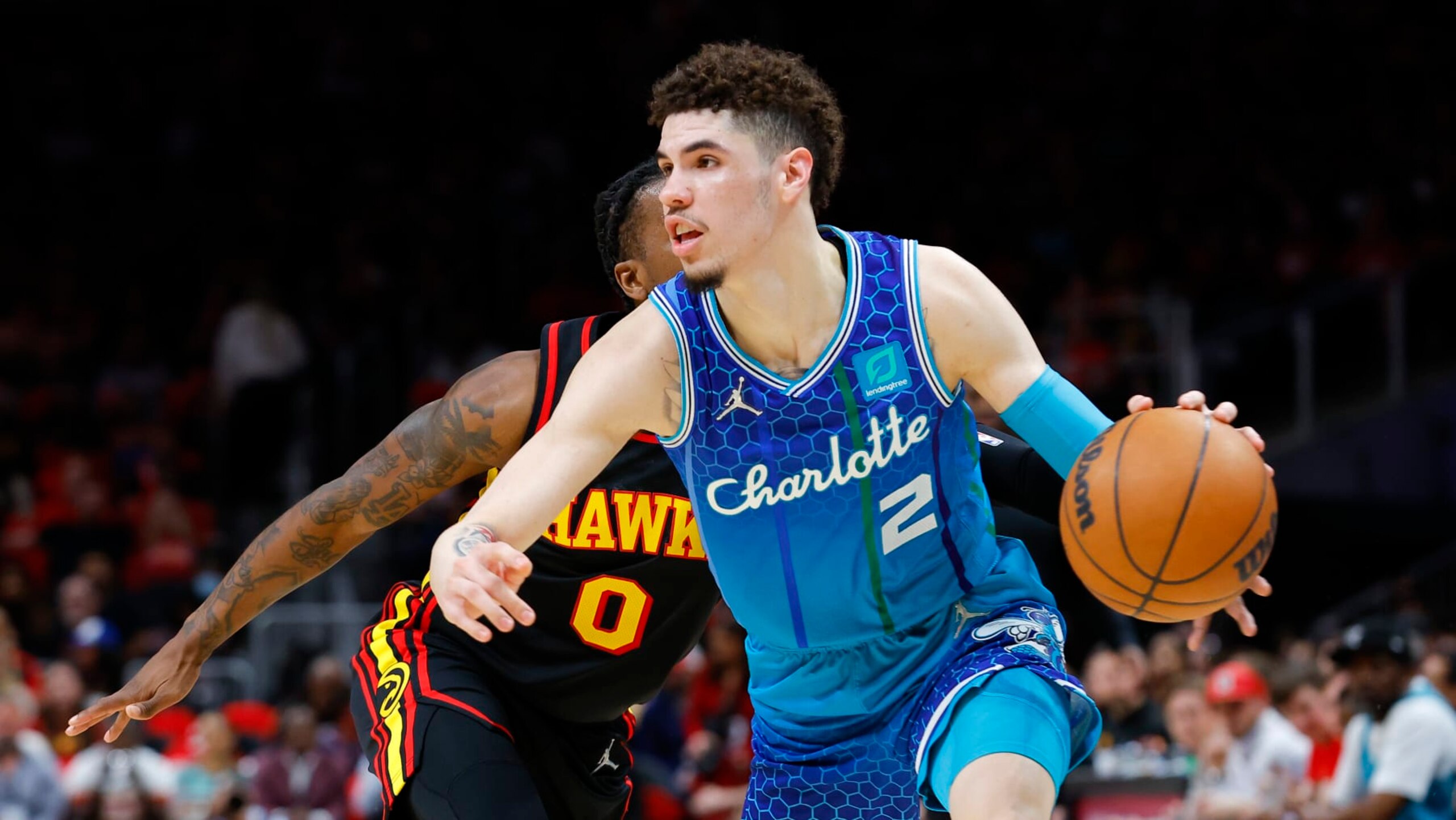 ATLANTA, GA - APRIL 13: LaMelo Ball #2 of the Charlotte Hornets dribbles the ball to the basket during the first half against the Atlanta Hawks at State Farm Arena on April 13, 2022 in Atlanta, Georgia. NOTE TO USER: User expressly acknowledges and agrees that, by downloading and or using this photograph, User is consenting to the terms and conditions of the Getty Images License Agreement. (Photo by Todd Kirkland/Getty Images)