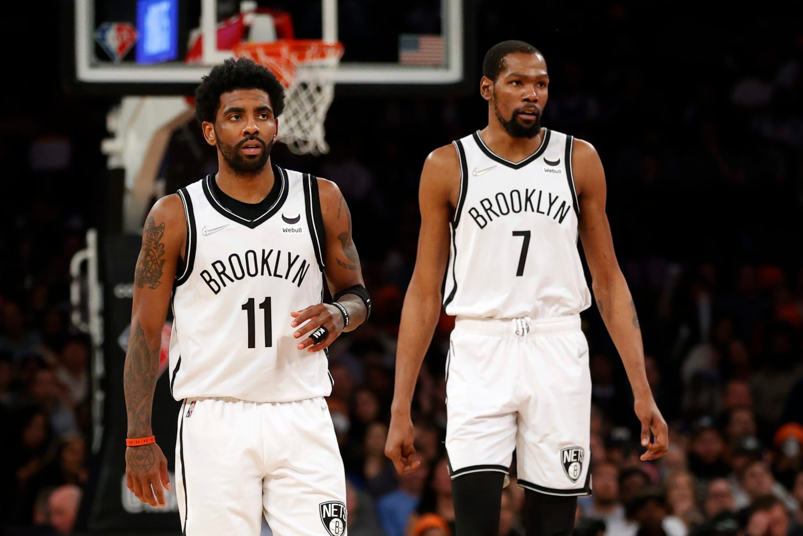 NEW YORK, NEW YORK - APRIL 06: Kyrie Irving #11 and Kevin Durant #7 of the Brooklyn Nets look on during the first half against the New York Knicks at Madison Square Garden on April 06, 2022 in New York City. NOTE TO USER: User expressly acknowledges and agrees that, by downloading and or using this photograph, User is consenting to the terms and conditions of the Getty Images License Agreement.  (Photo by Sarah Stier/Getty Images)