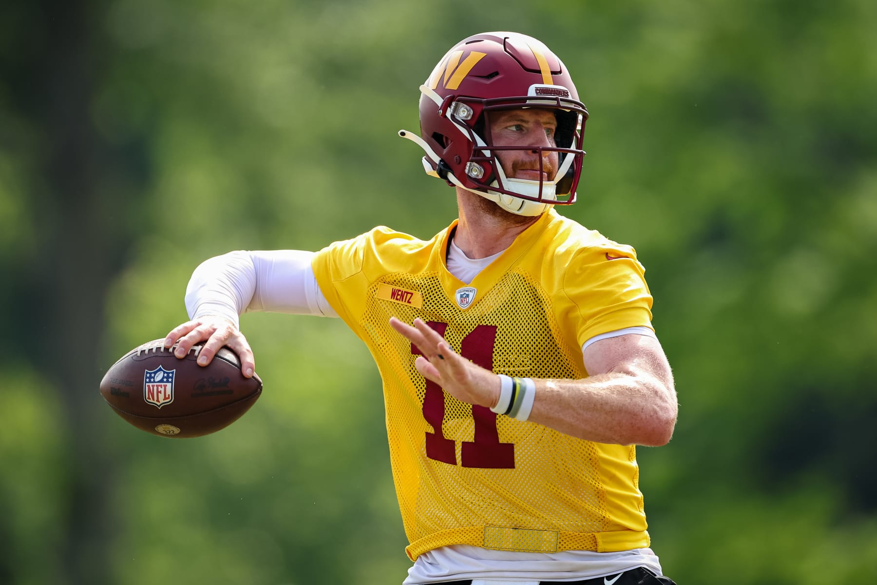 ASHBURN, VA - JUNE 16: Carson Wentz #11 of the Washington Commanders participates in a drill during the organized team activity at INOVA Sports Performance Center on June 16, 2022 in Ashburn, Virginia. (Photo by Scott Taetsch/Getty Images)