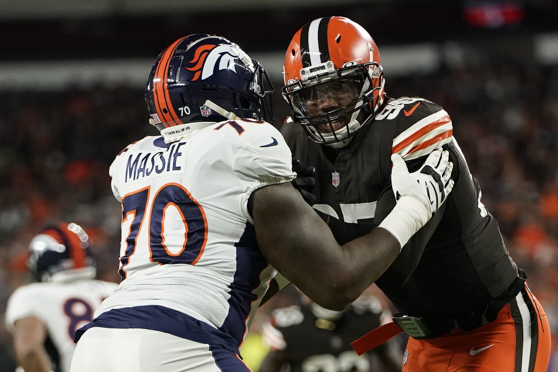 CLEVELAND, OHIO - OCTOBER 21: Myles Garrett #95 of the Cleveland Browns battles with Bobby Massie #70 of the Denver Broncos during an NFL game at FirstEnergy Stadium on October 21, 2021 in Cleveland, Ohio. (Photo by Cooper Neill/Getty Images)