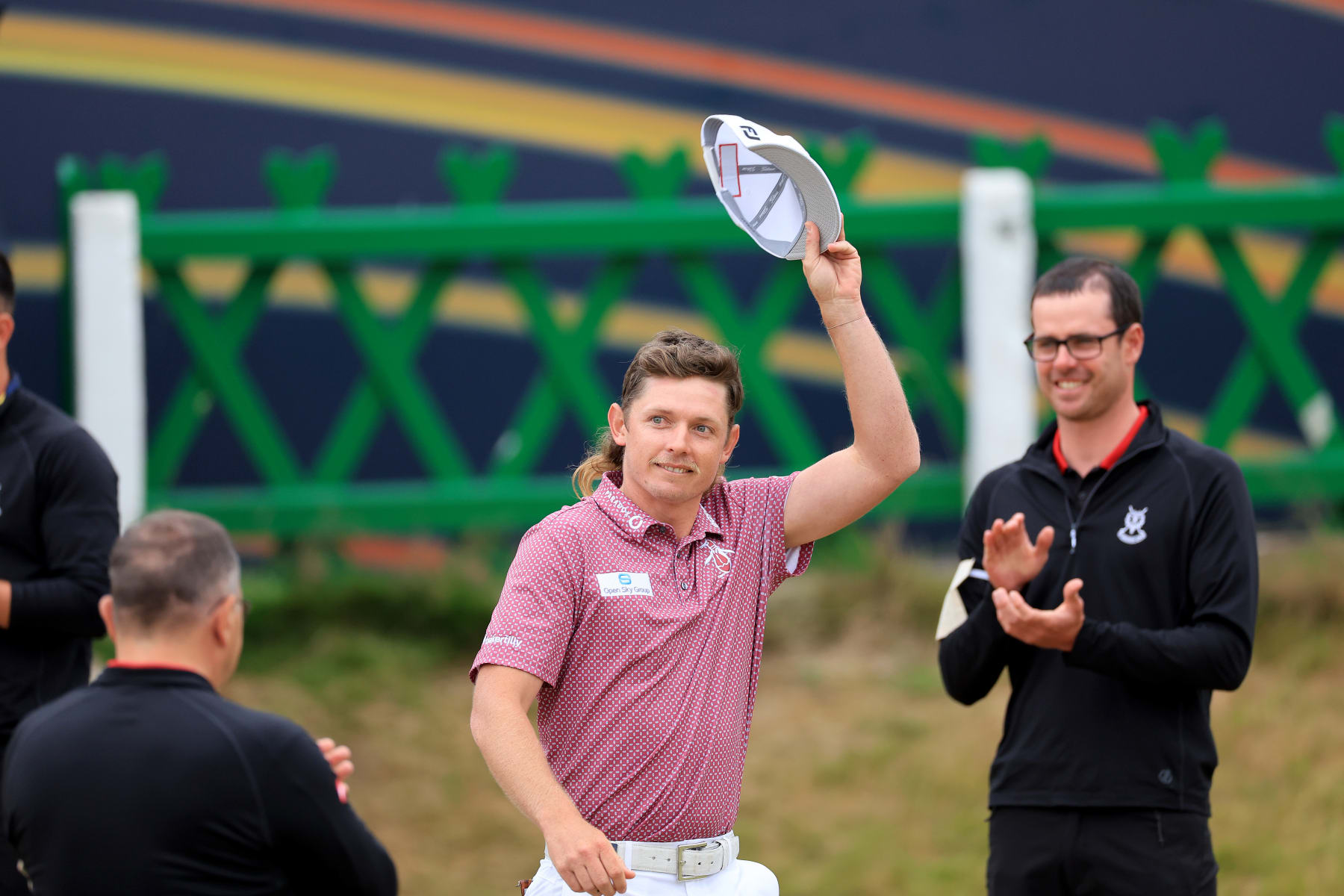 ST ANDREWS, SCOTLAND - JULY 17: Cameron Smith of Australia walks past the green keepers guard of honour on his way to being presented with the Claret Jug after his victory in the final round of The 150th Open on The Old Course at St Andrews on July 17, 2022 in St Andrews, Scotland. (Photo by David Cannon/Getty Images)