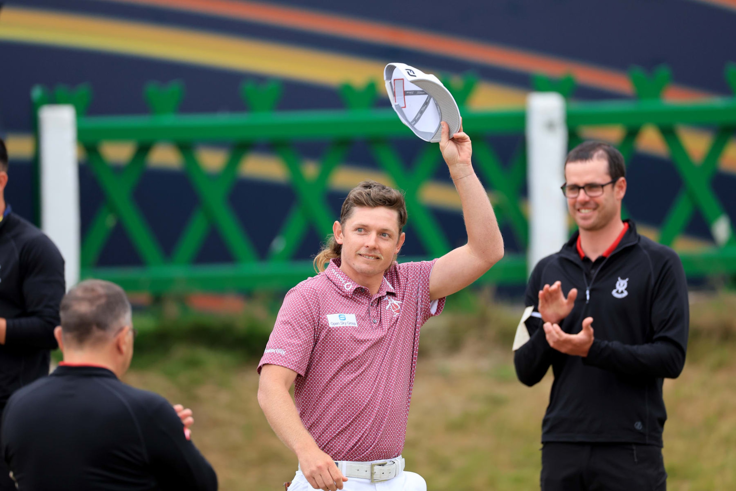 ST ANDREWS, SCOTLAND - JULY 17: Cameron Smith of Australia walks past the green keepers guard of honour on his way to being presented with the Claret Jug after his victory in the final round of The 150th Open on The Old Course at St Andrews on July 17, 2022 in St Andrews, Scotland. (Photo by David Cannon/Getty Images) ST ANDREWS, SCOTLAND - JULY 17: Cameron Smith of Australia walks past the green keepers guard of honour on his way to being presented with the Claret Jug after his victory in the final round of The 150th Open on The Old Course at St Andrews on July 17, 2022 in St Andrews, Scotland. (Photo by David Cannon/Getty Images)
